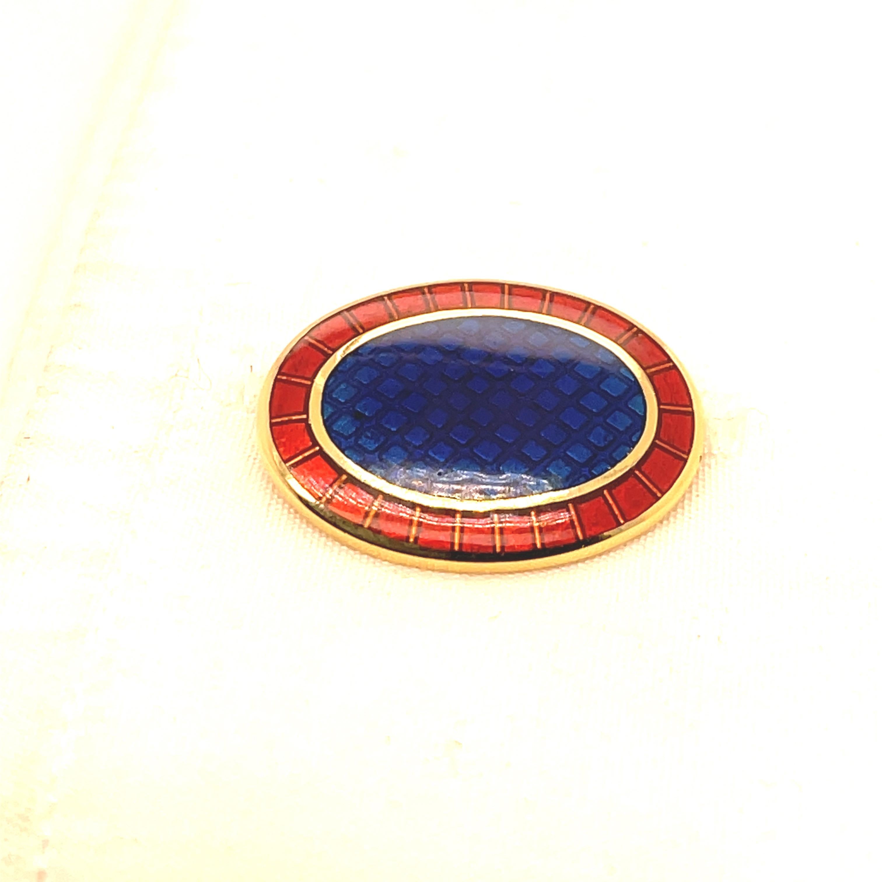 Large striking double-sided cufflinks.  Made and signed by TIFFANY & CO.  Solid gauge 18K yellow gold.  The centers are cobalt blue guilloche enamel; the outer borders are a geometric red guilloche enamel pattern.  Double-sided with chain link