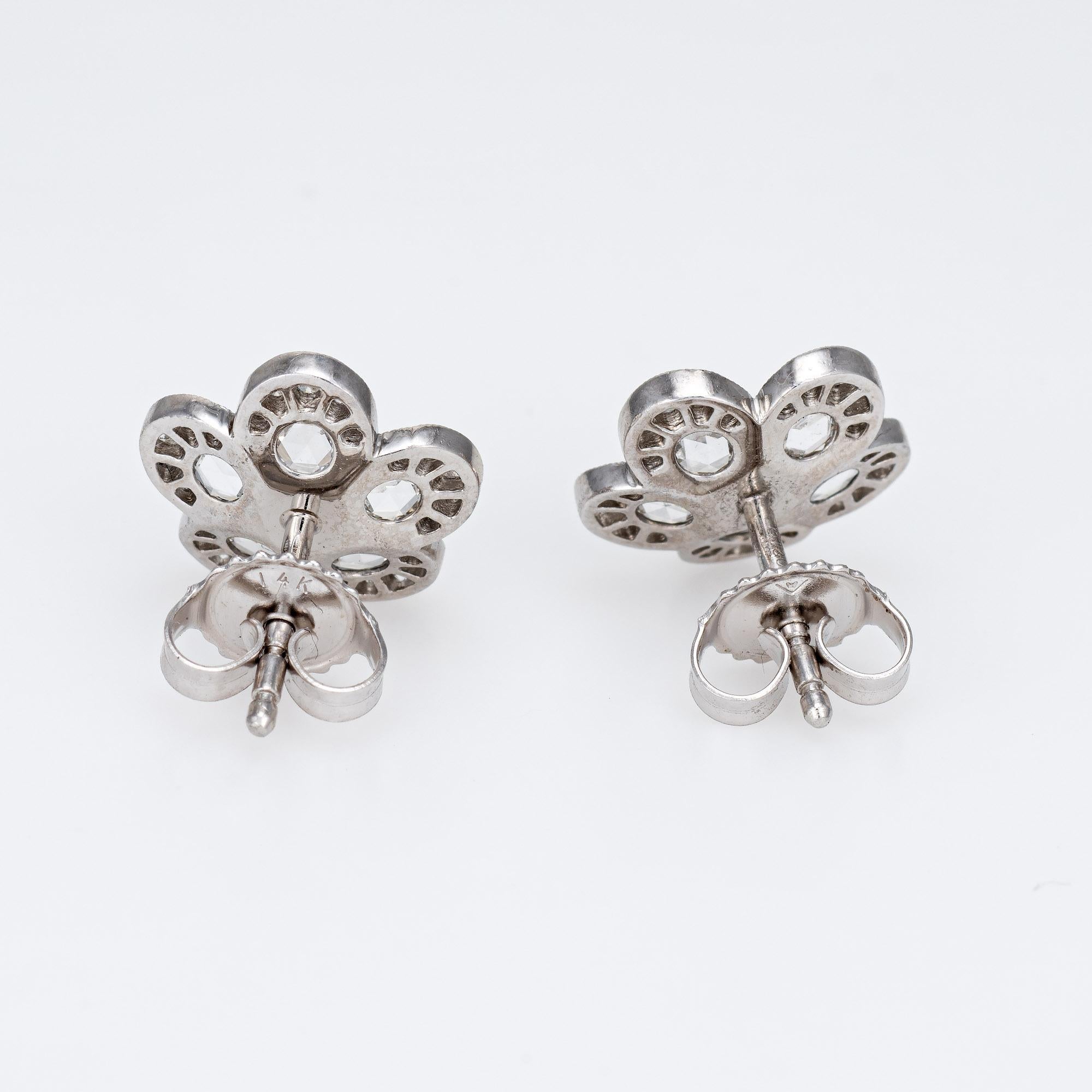 Estate Tiffany & Co diamond flower earrings from the 'Enchant' collection, crafted in platinum.  

Rose cut and round brilliant cut diamonds total an estimated 0.50 carats (estimated at F-G color and VVS2 clarity).

From the Tiffany & Co 'Enchant'