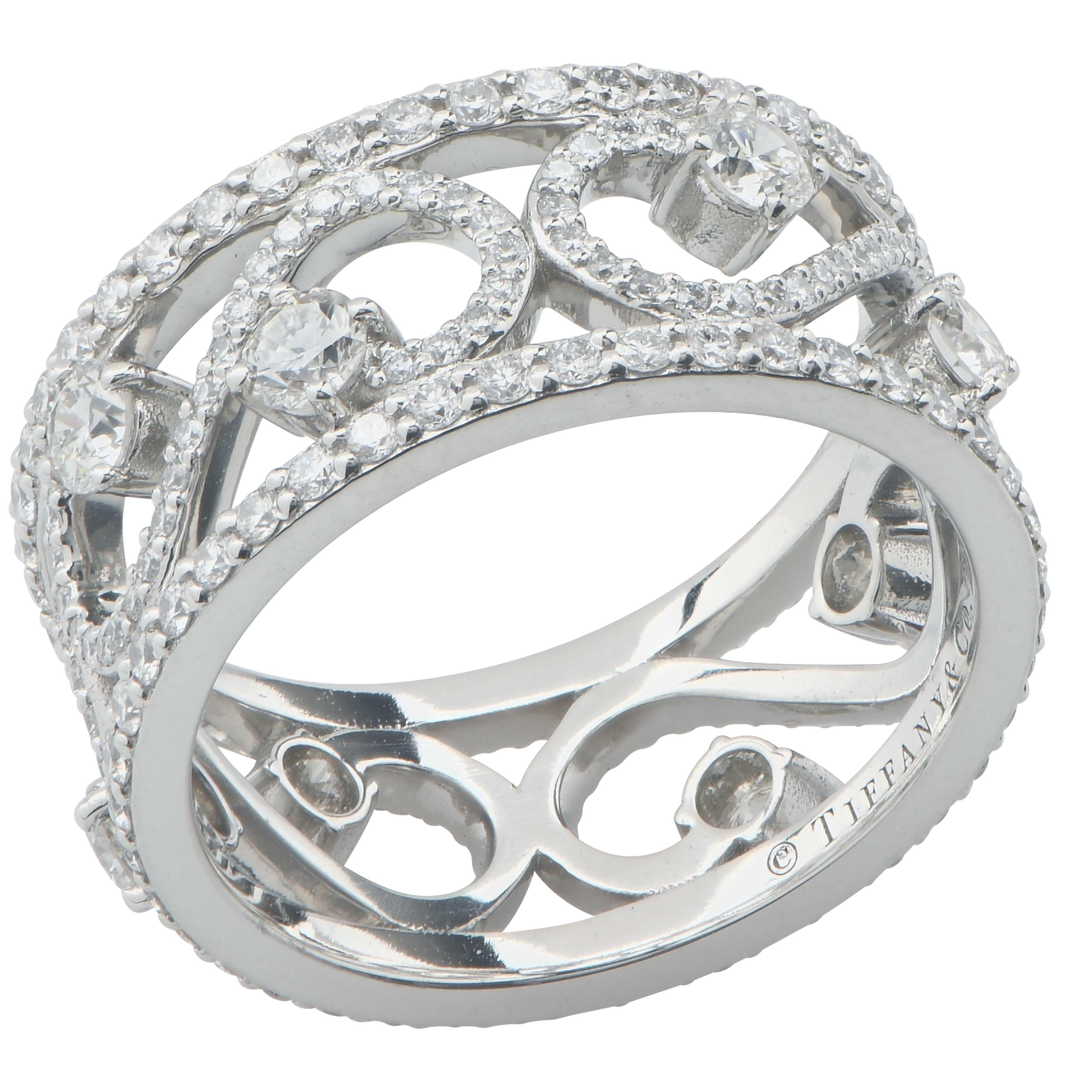 Tiffany & Co. Enchant Scroll Band Ring in 18 Karat White Gold
220 diamonds 
Size 5.5 (resizing not possible)
