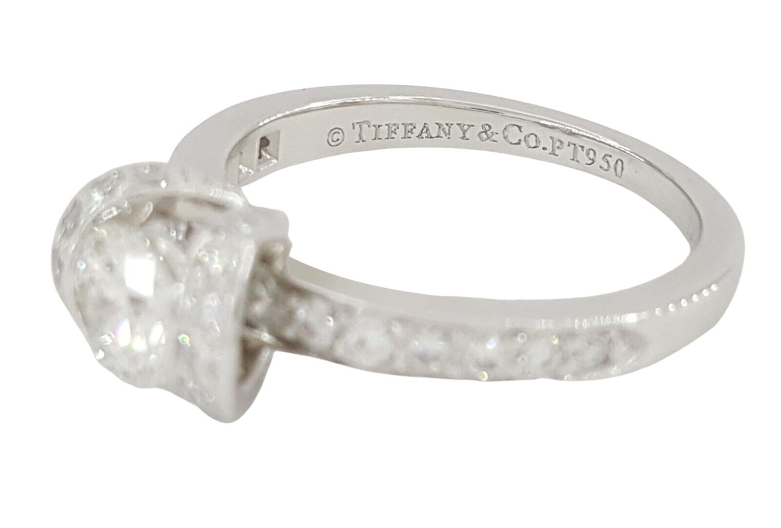 Original Tiffany & Co. Ribbon engagement ring.
 approx 1.01ct TW, most about F-G-H and VS range. Center diamond 0.44ct

Marked: Tiffany & Co. PT950 0.44 serial # 21302767

Ring size 6 (Sizable)

Total Weight: 4.9 grams