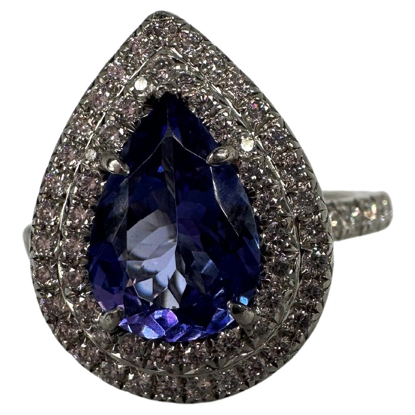 Tiffany & Co tanzanite and diamond ring in platinum, exquisite craftsmanship by a wonderful designer, the ring has a stunning violet center Tanzanite at 1.5 carats.

METAL: PLATINUM
NATURAL DIAMOND(S)
Clarity/Color: VS/F
Carat:0.45ct
Cut:Round