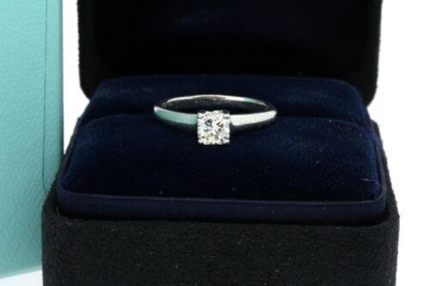 Here we have a vintage 1999 Tiffany & Co. platinum .54ct Lucida diamond engagement ring size 5.5 with certificate, folder and box.
**Specifics**
- Measurements: Finger size 5.5 and 5mm wide across the widest point.
- Stones: .54 carat Lucida diamond