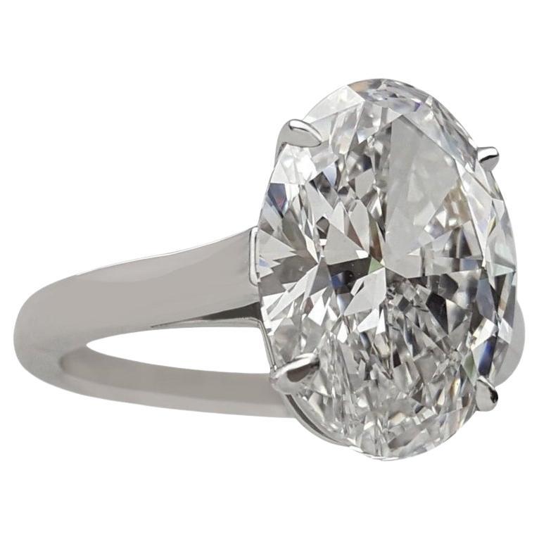 Tiffany & Co. engagement ring featuring an impressive 5.01 ct oval cut diamond with excellent attributes. The diamond weighs 5.01 ct, has an F color rating (colorless), and is graded as VS1 in clarity (very slight inclusions). It boasts an excellent