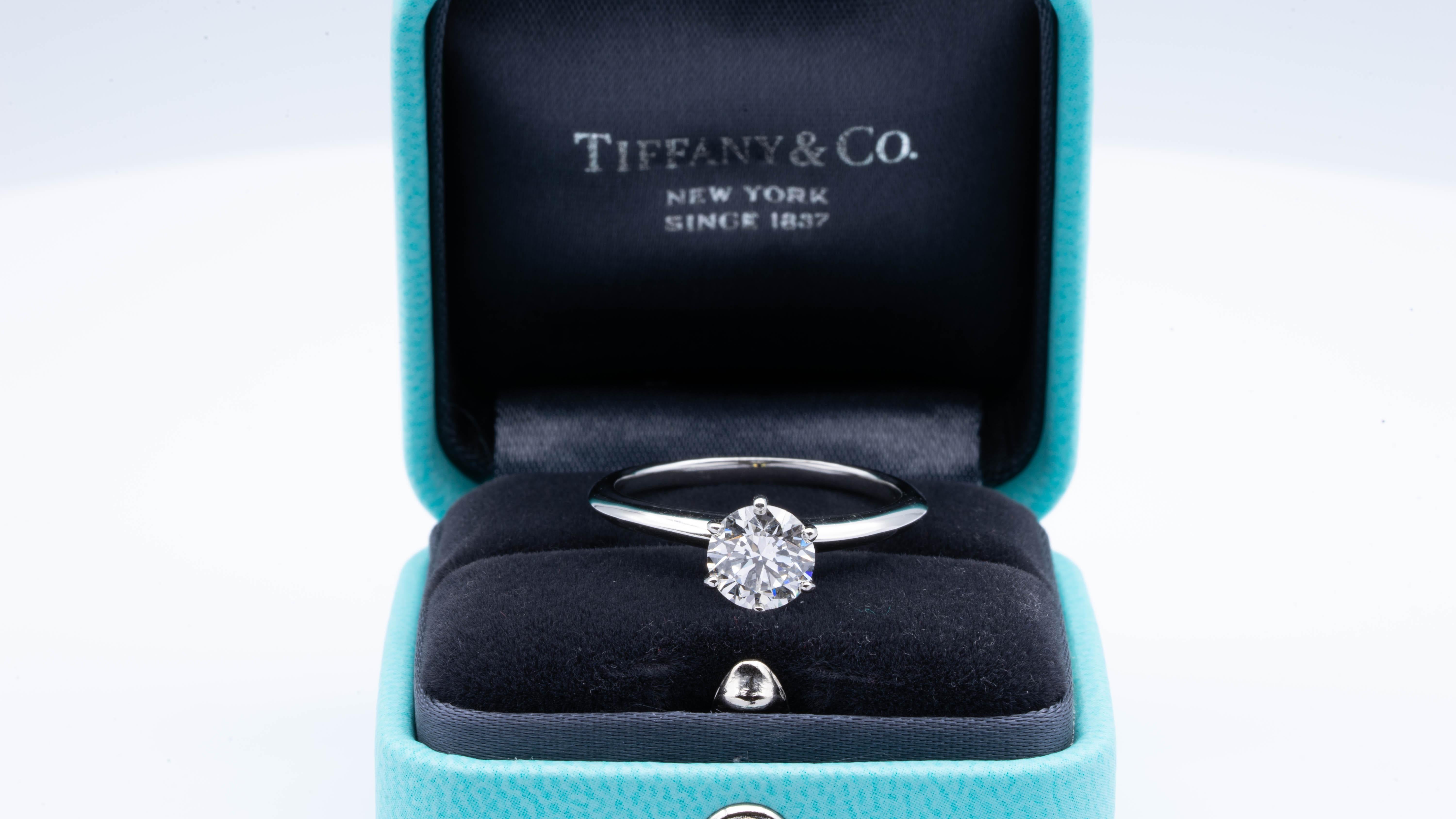 Tiffany & Co Round Brilliant Classic Solitaire Engagement Ring featuring a 1.26 ct Center I color, VVS2 clarity, finely crafted in a 6 prong Platinum Mounting. 
( Current Retail for $18,900)

Stamped: Tiffany & Co. PT 950 37967394, D 1.26 CT
Ring