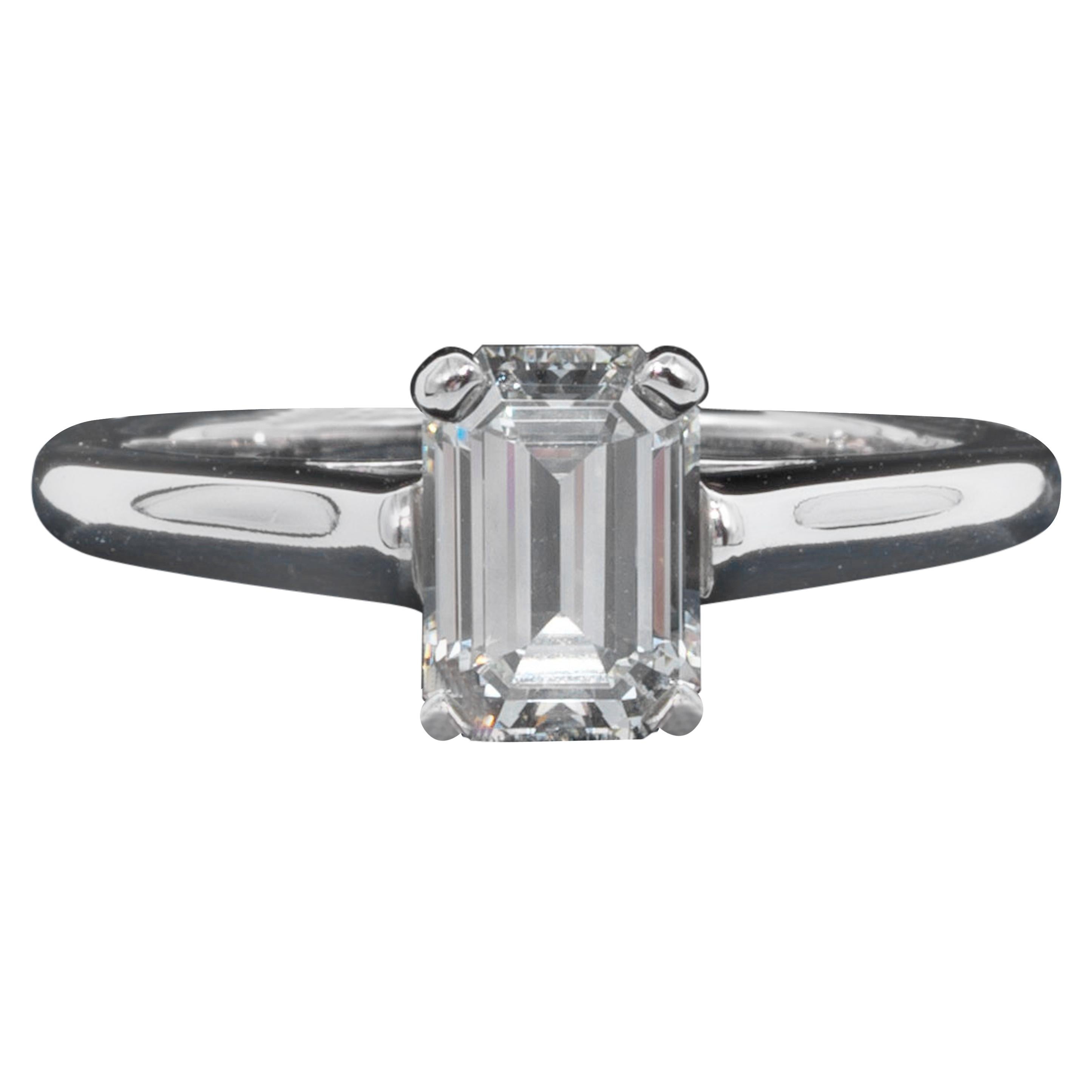 Tiffany & Co. Diamond Engagement Solitaire signed by Tiffany & Co. featuring a 1.07 ct Emerald Cut Center, graded by Tiffany,  I color , and VS2 Clarity.
In Platinum
Includes Original Tiffany Certificate and Box
Diamond registration #: D11247

Ring