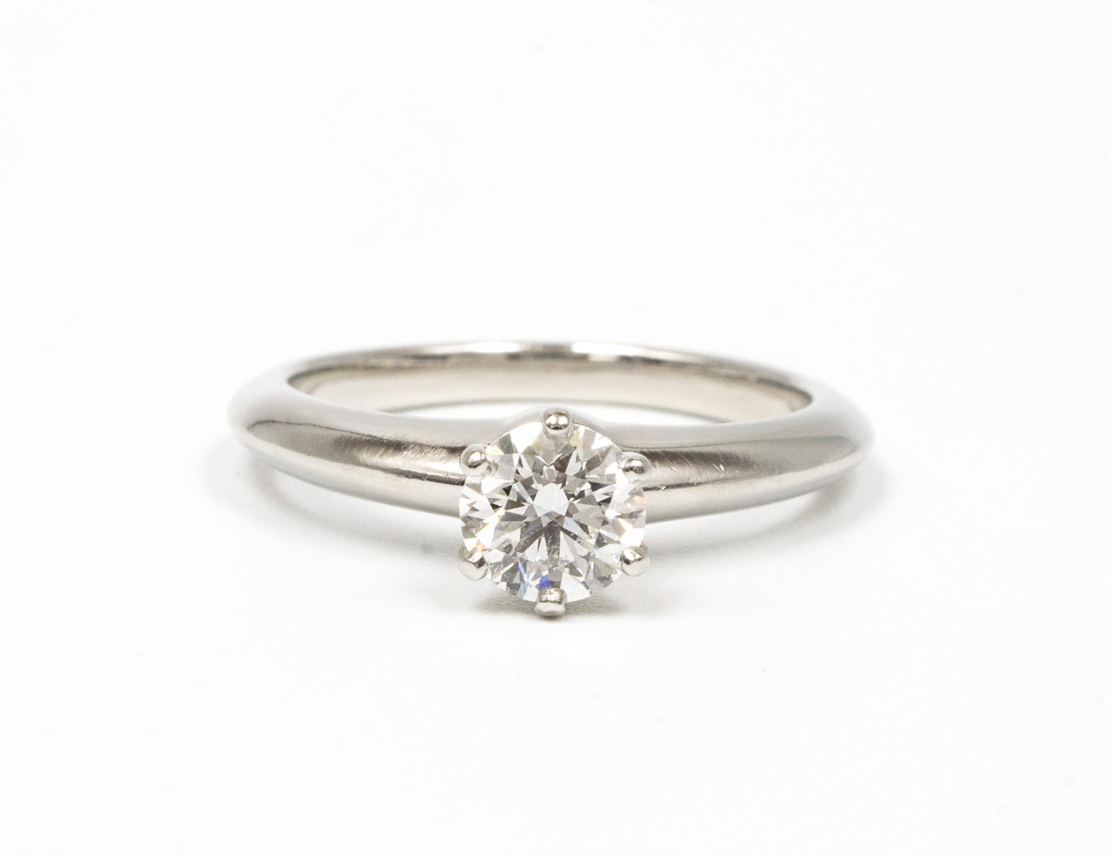 Tiffany & Co. Diamond Engagement Solitaire signed by Tiffany & Co. featuring a .66 ct Center, graded by Tiffany H color , and SI1 Clarity.
In Platinum
Includes Original Tiffany Certificate and Box
Crown Inscription T&C L01140081 

Retail Approx