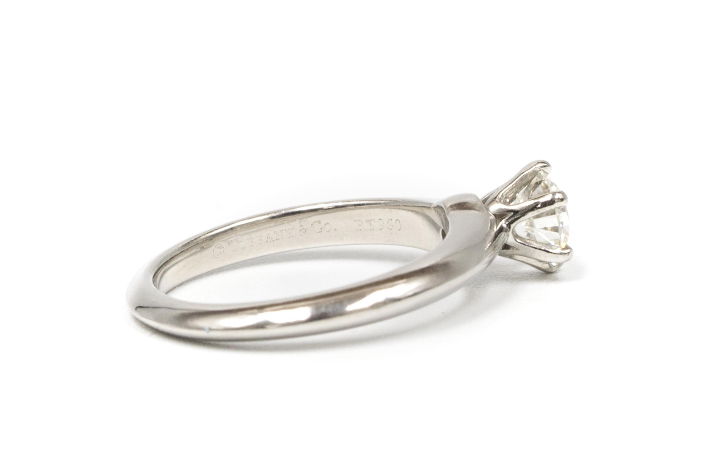 Round Cut Tiffany & Co. Engagement Ring with .66 Carat Round Brilliant Centre in Platinum