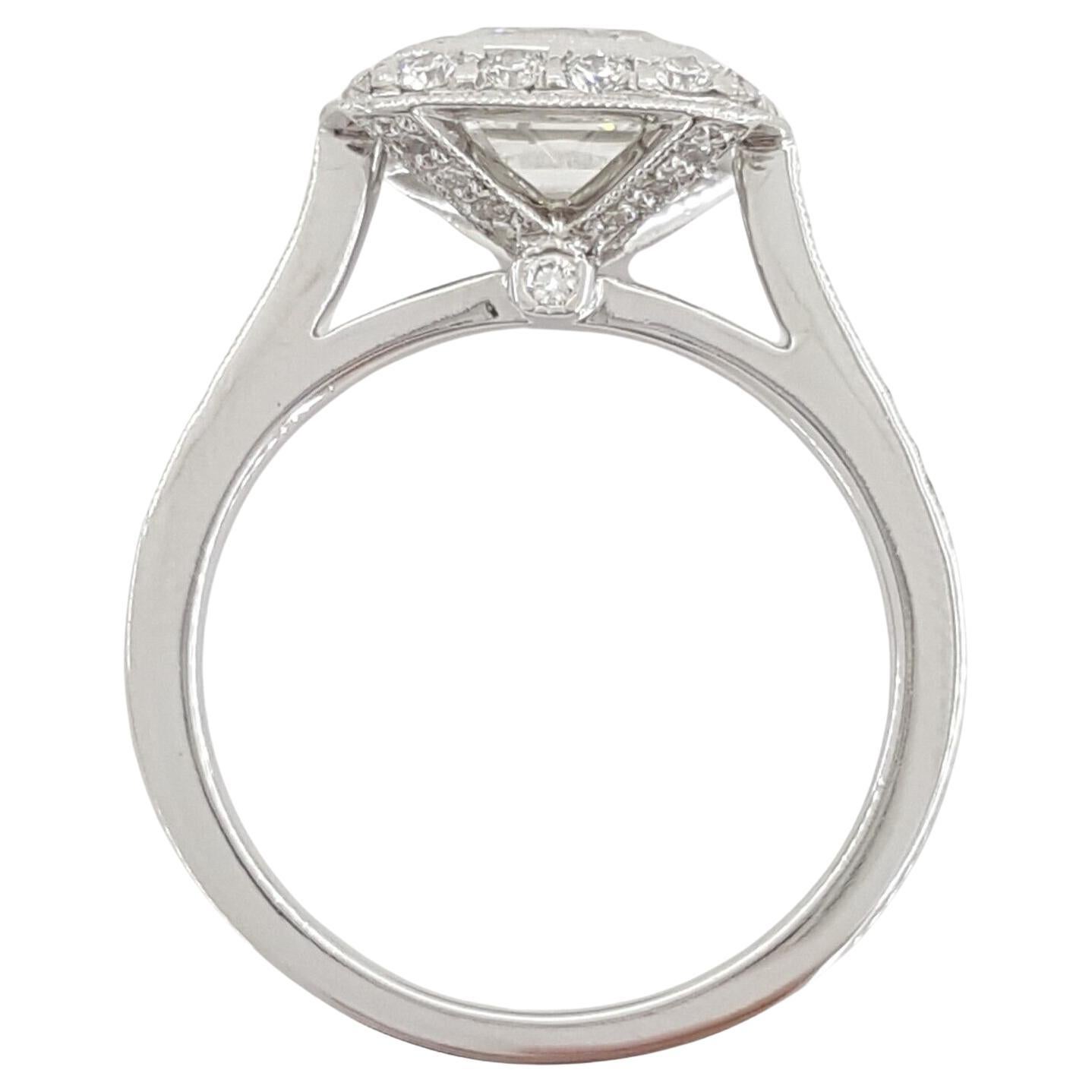 This exquisite Tiffany & Co. engagement ring is a true masterpiece, featuring a stunning Legacy Cushion Brilliant Cut Diamond at its center. Here are the details that make this ring a symbol of enduring elegance:

Center Stone: The ring showcases a
