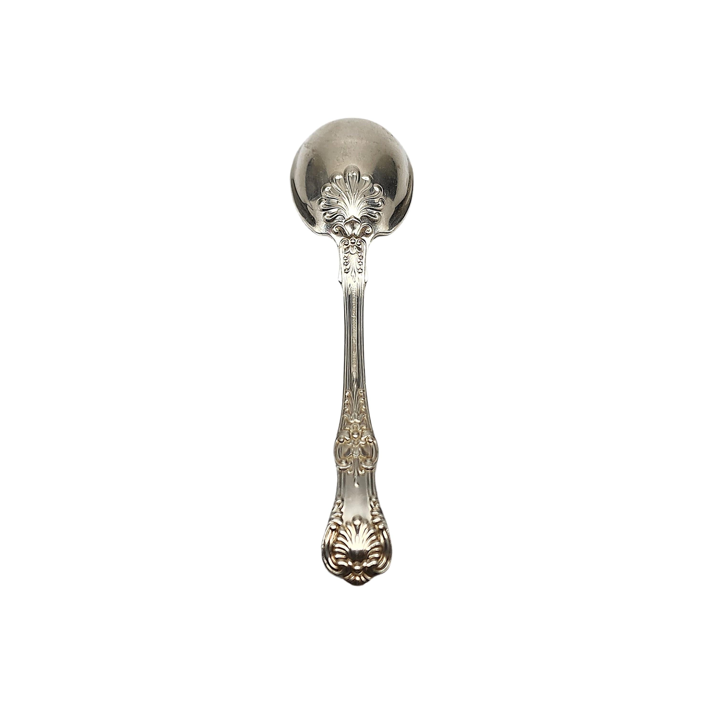Sterling silver sugar spoon by Tiffany & Co in the English King pattern.

No monogram.

Beautiful small spoon in Tiffany's intricate and decorative version of a King pattern, which were very popular in the late 19th century. The M mark dates this