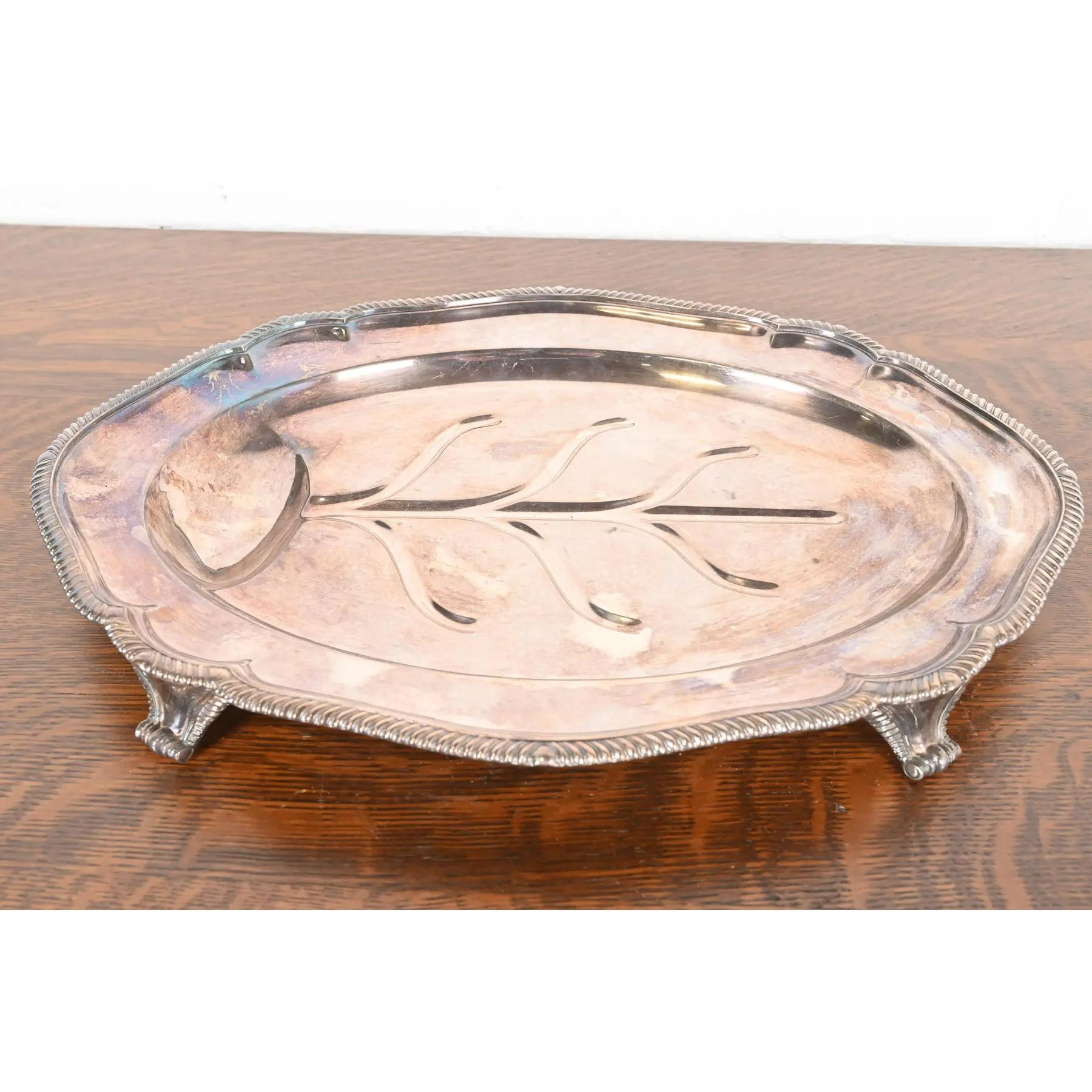 A gorgeous English silverplate Tree of Life footed serving tray

By Tiffany & Co. (signed to the underside)

England, Mid-20th Century

Measures: 20.13