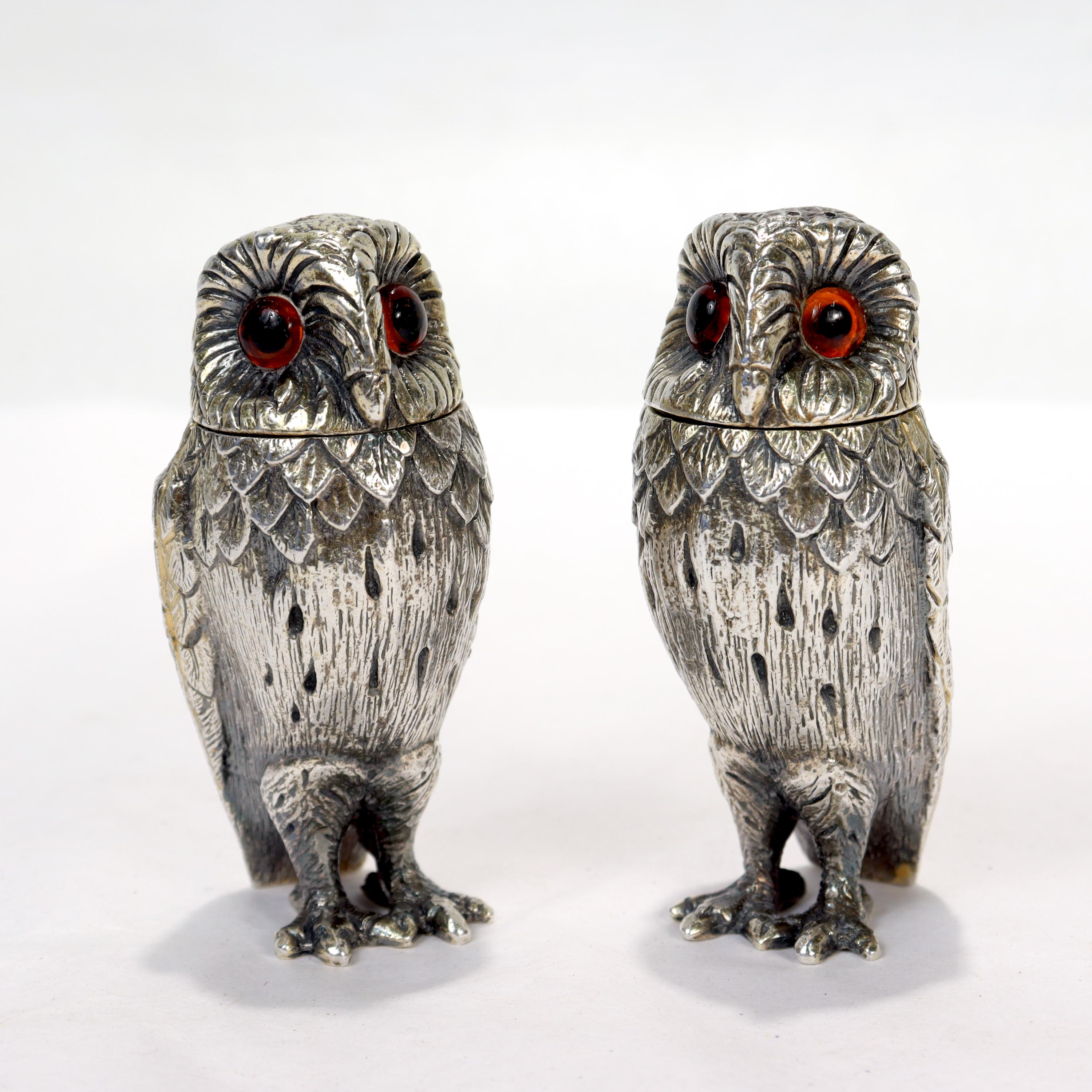 A fine pair of English owl form salt & pepper shakers.

In sterling silver with glass eyes. 

By Tiffany & Co.

Simply terrific shakers by Tiffany!

Date:
1960

Overall Condition:
The shakers appear to retain traces of a gold wash. Otherwise, they