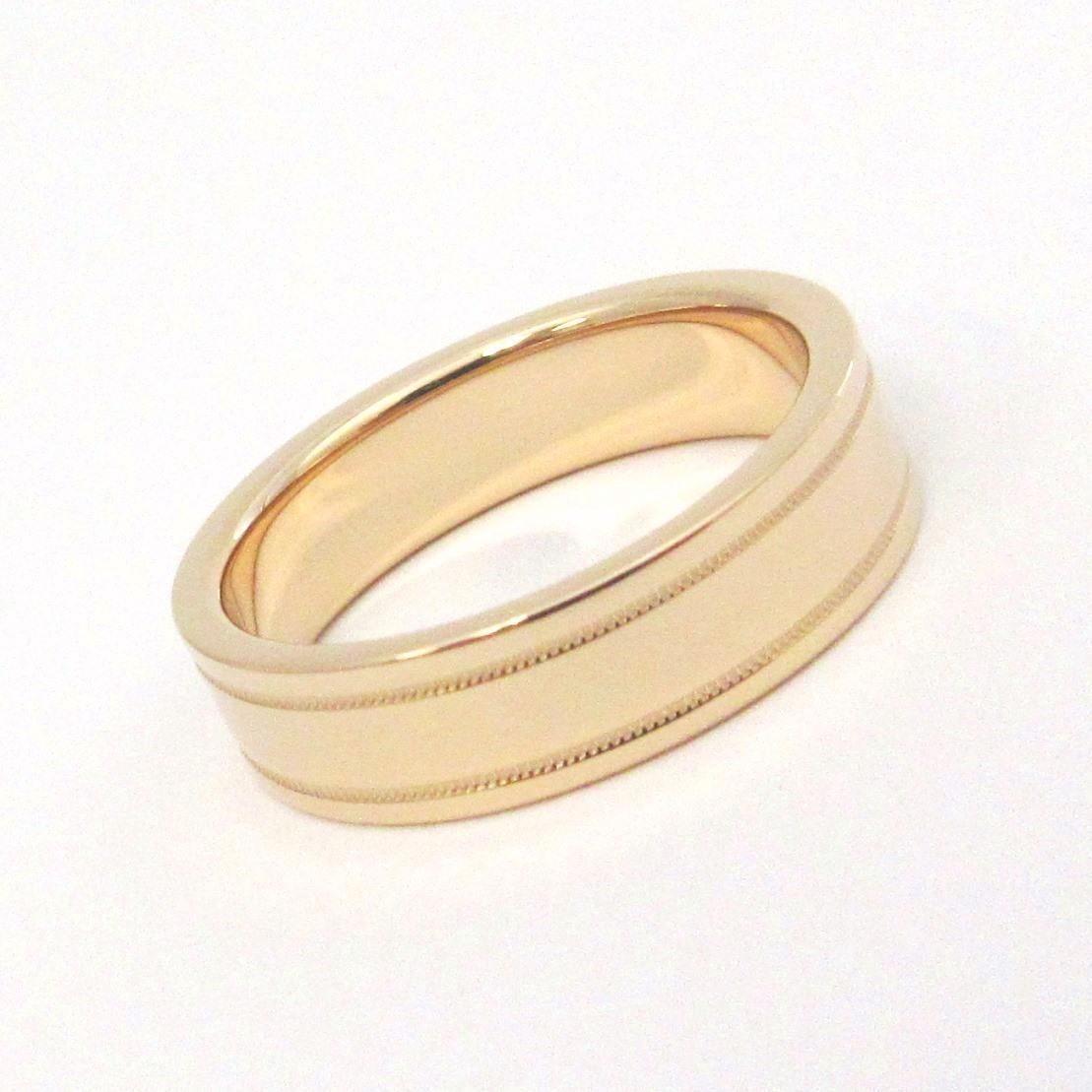 TIFFANY & Co. Essential Band 18K Rose Gold 6mm Double Milgrain Ring 10.5

 Metal: 18K Rose Gold 
 Size: 10.5 
 Band Width: 6mm
 Weight: 11.30 grams
 Hallmark: ©TIFFANY&CO. AU750
 Condition: Excellent condition, like new

Authenticity Guaranteed
