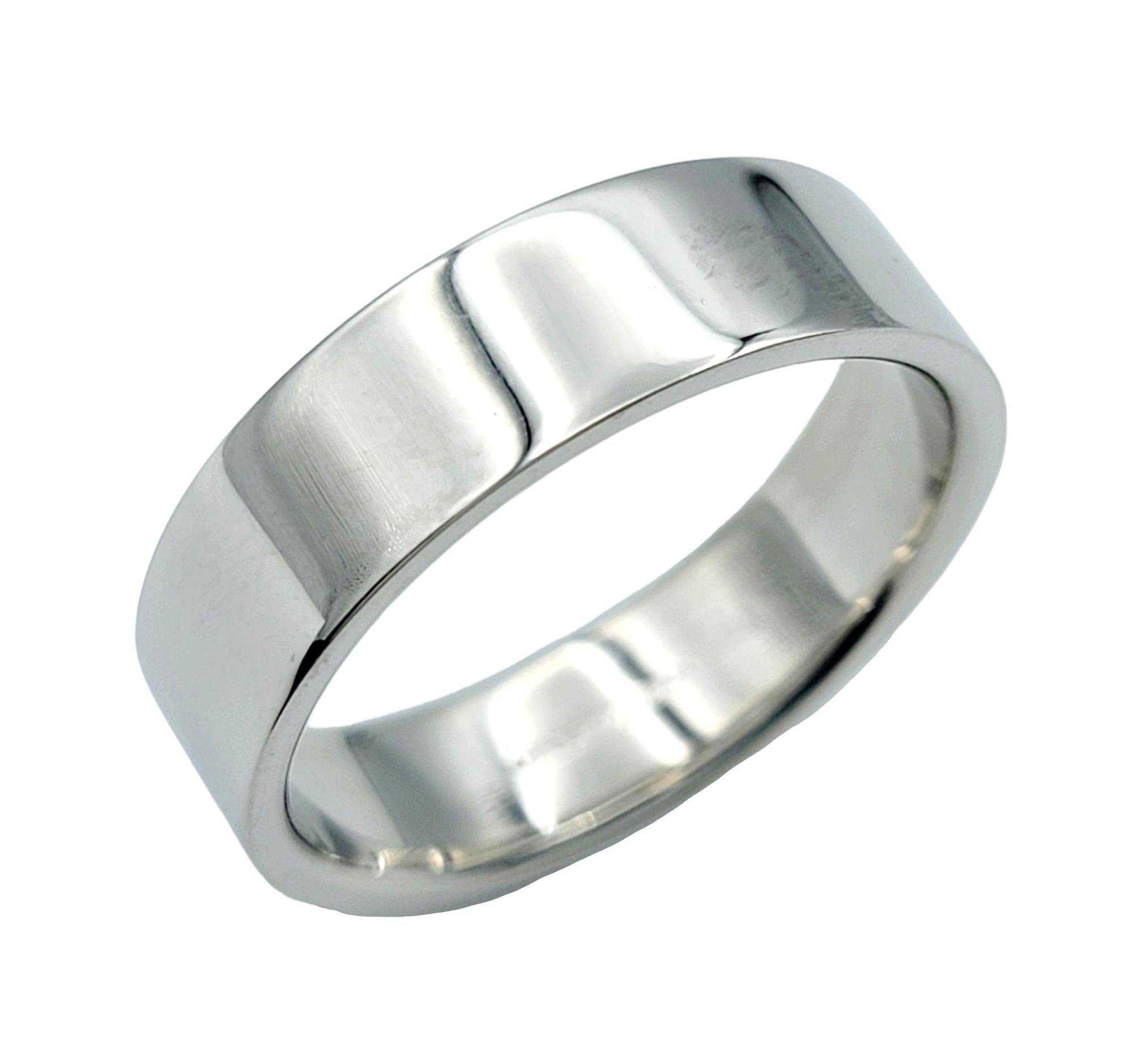 Ring Size: 9.5

Elegance meets simplicity in this timeless Tiffany & Co band ring crafted from luxurious platinum. The 6 mm width of the ring provides a substantial presence on the finger, while the high-polish finish accentuates the inherent luster