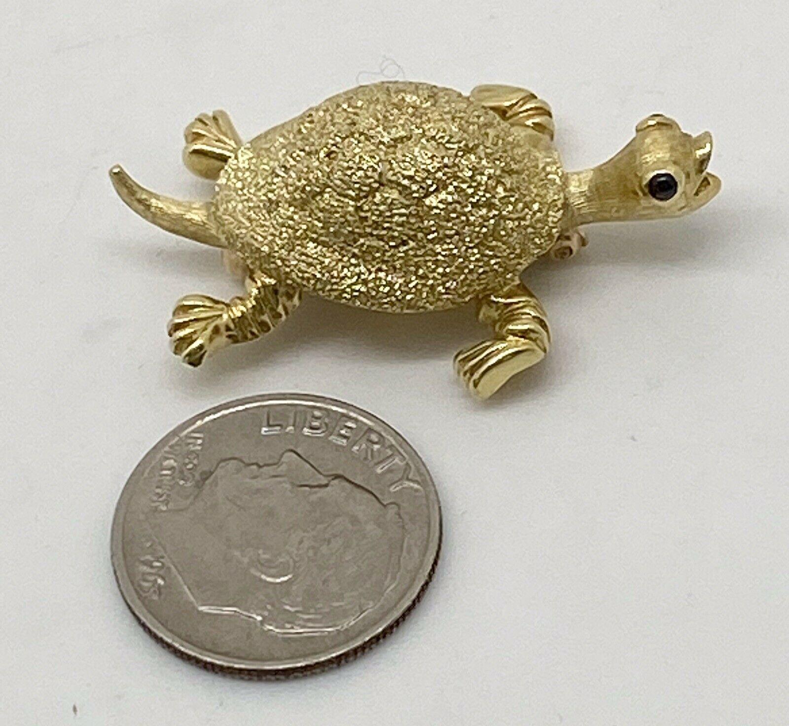 Tiffany & Co. Vintage 18k Yellow Gold & Cabochon Sapphire Turtle Brooch / Pin

Here is your chance to purchase a beautiful and highly collectible vintage turtle brooch.  Truly a great piece at a great price! 

Weight: 9.4 grams

Condition: Great