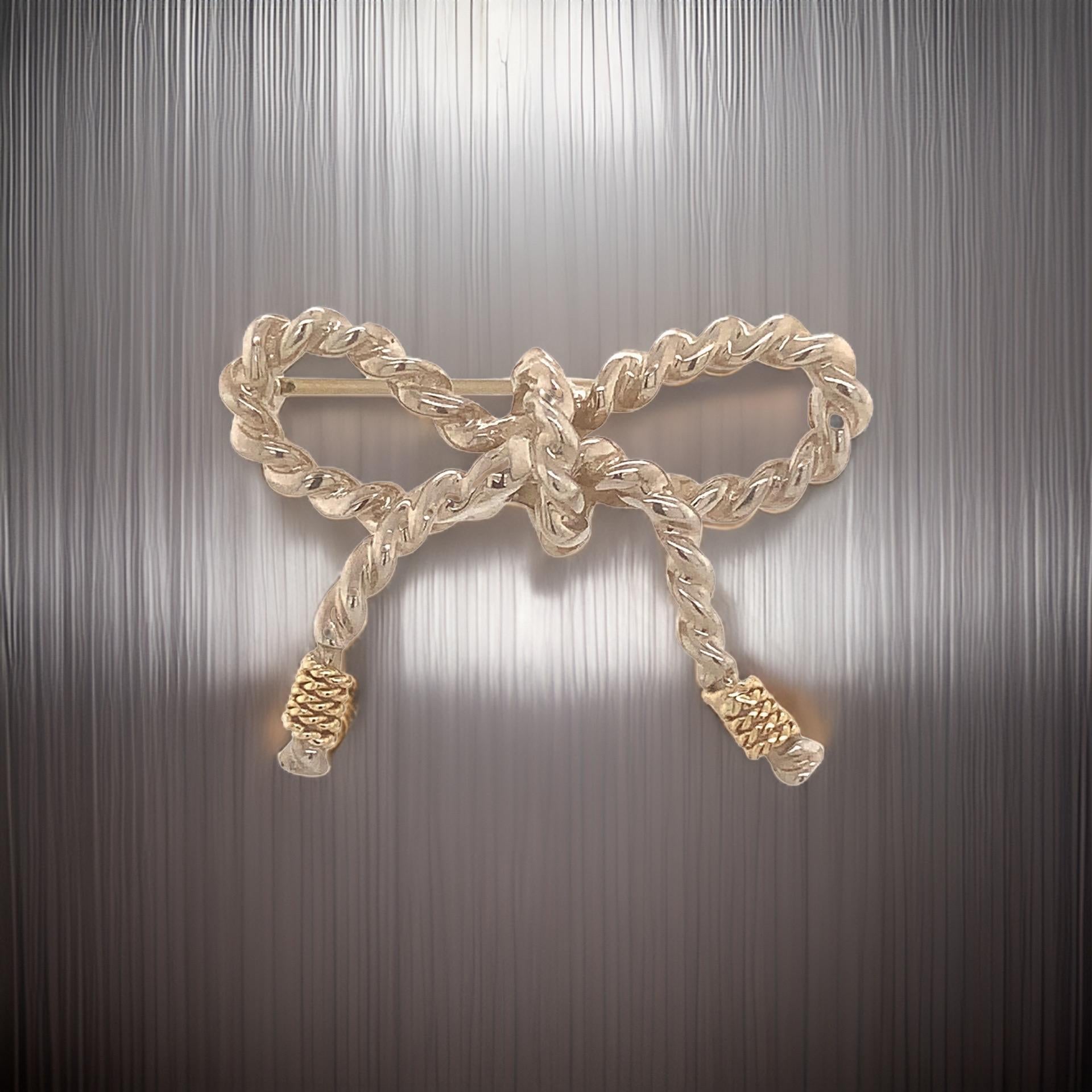 Authentic Tiffany & Co Estate Bow Brooch Pin 18k Gold + Sterling Silver TIF769

This elegant Authentic Tiffany & Co bow brooch is made of sterling silver & 18 kt yellow gold and has a weight of 5.80 grams.

TRUSTED SELLER SINCE 2002

PLEASE SEE OUR