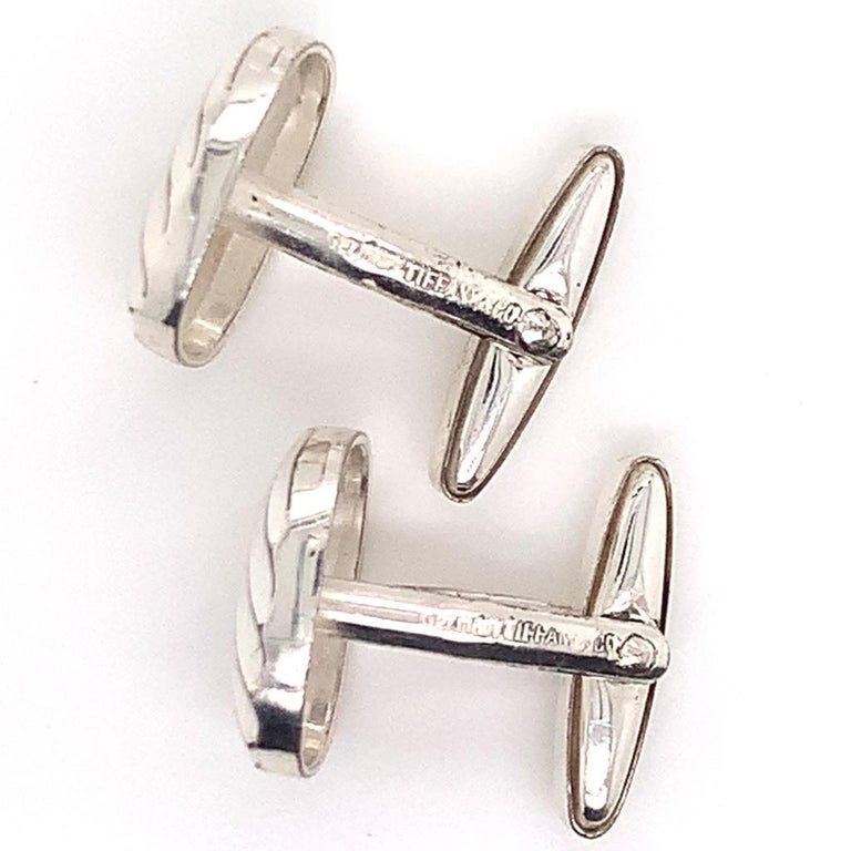 Tiffany & Co. Estate Cufflinks Sterling Silver 6.528 Gr TIF13

This elegant Authentic Tiffany & Co Men's Cuff-links has a weight of 6.528 Grams.

The Tiffany & Co items have the natural patina As they are estate silver pieces.

Many clients wish to