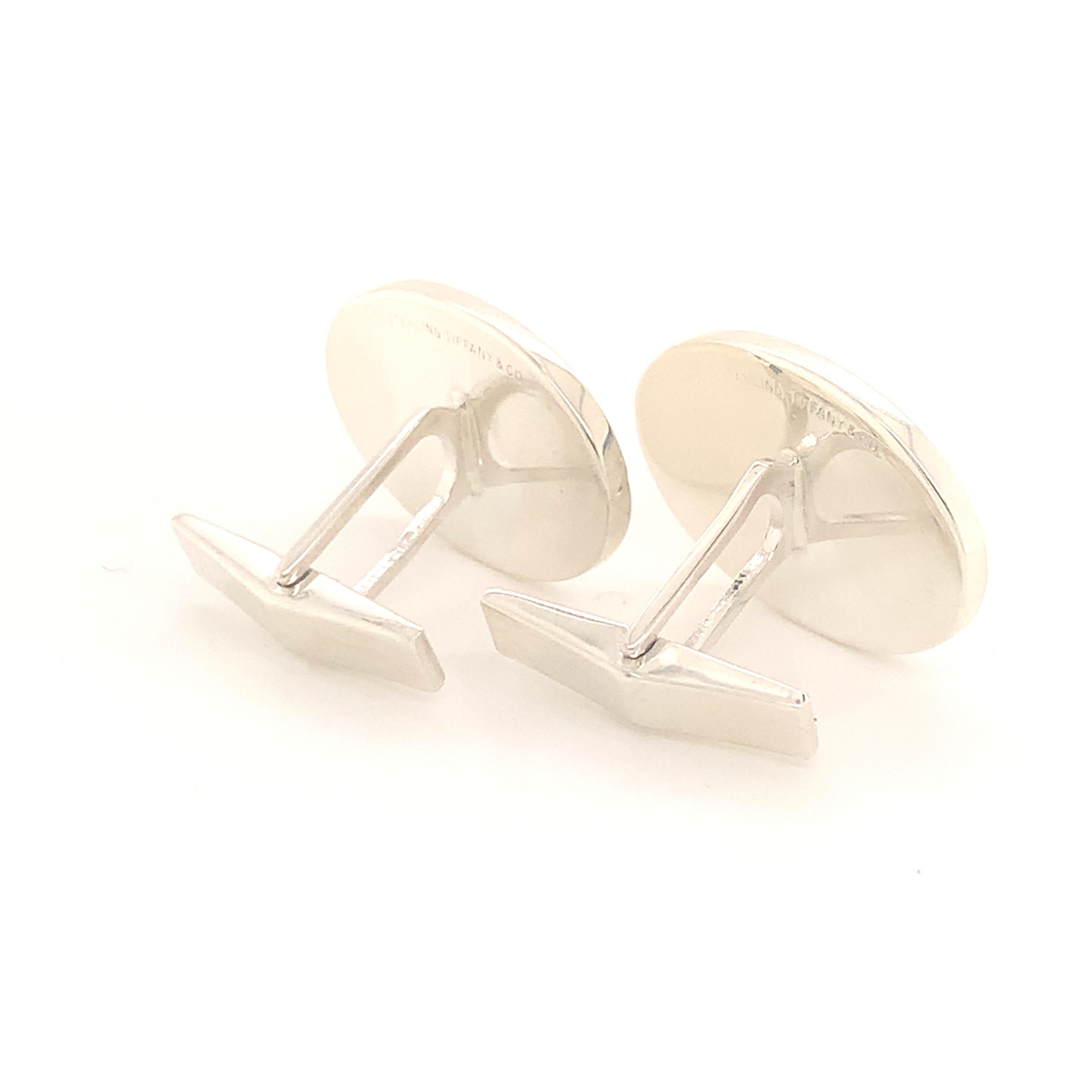 Tiffany & Co Estate Cufflinks Sterling Silver TIF32
  
The Tiffany & Co items have a natural patina As they are estate silver pieces.
 
We polish most of our estate Tiffany pieces so that they will be fresh for their new owners but many clients wish