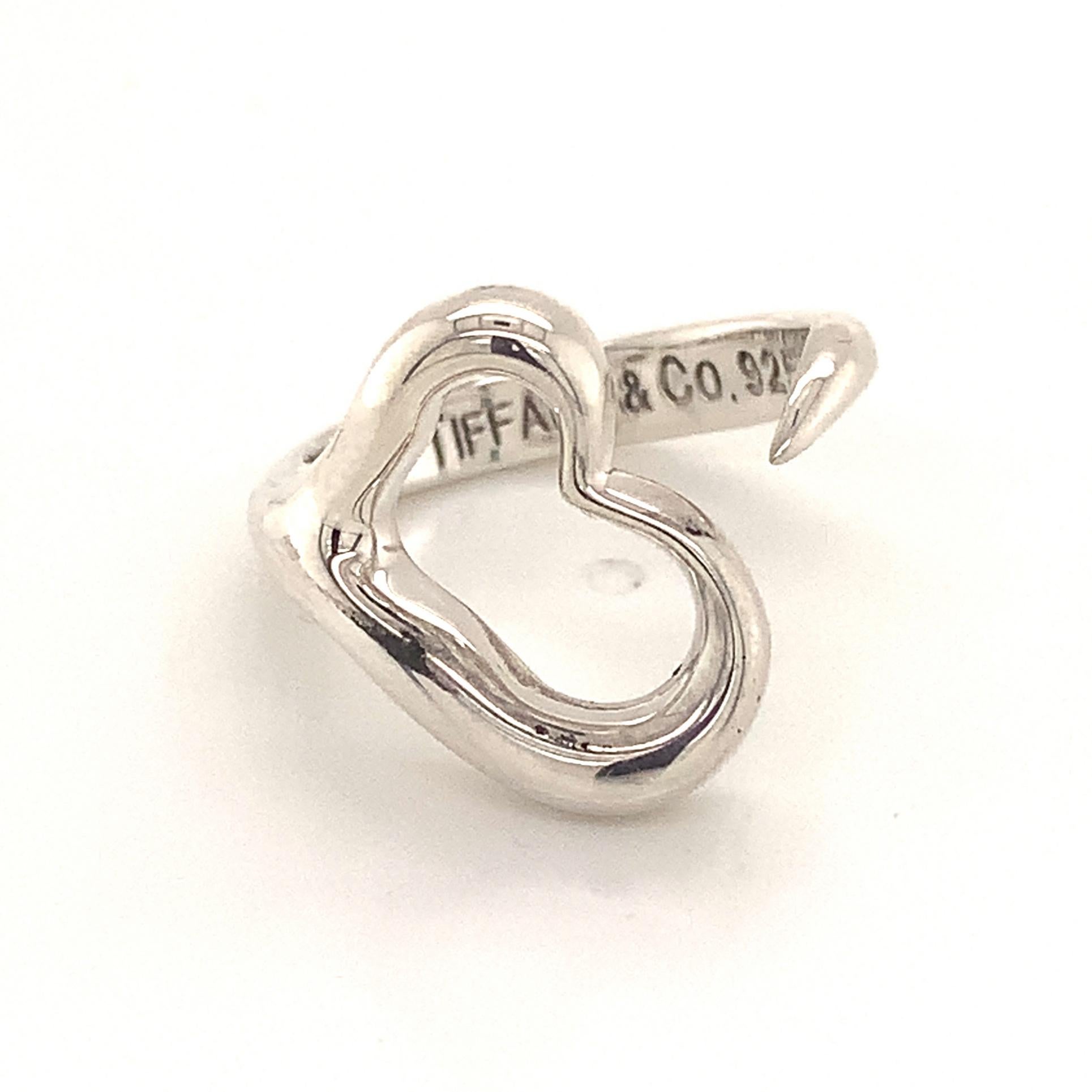 Tiffany & Co Estate Open Heart Ring Size 5 Sterling Silver 4.82 Grams TIF135
 
This elegant Authentic Tiffany & Co ring is made of sterling silver and has a weight of 4.82 grams.

TRUSTED SELLER SINCE 2002
 
PLEASE SEE OUR HUNDREDS OF POSITIVE