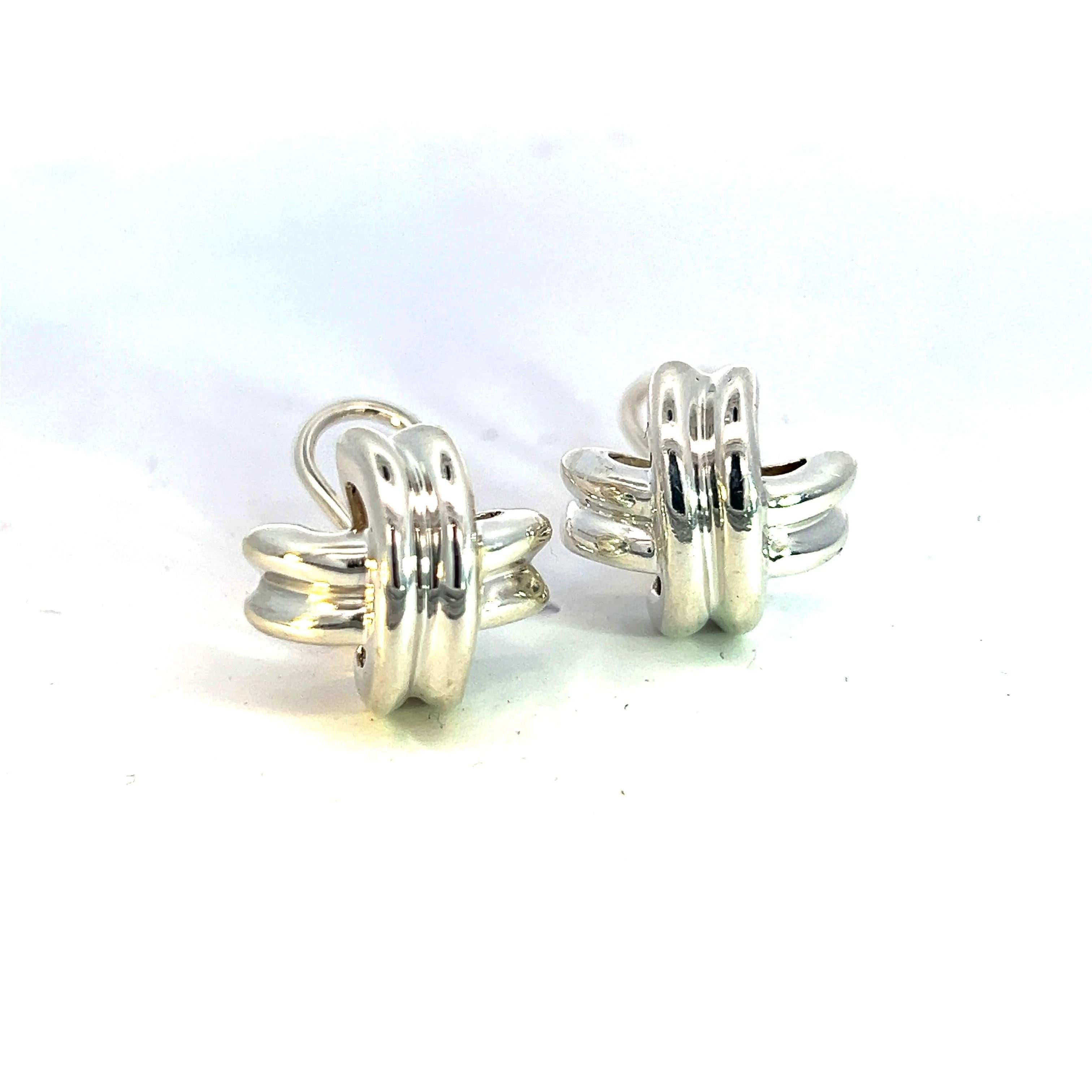 Tiffany & Co Estate Large “X” Signature Omega Back Earrings Sterling Silver TIF784

These Iconic Tiffany & Co. Estate Large “X” Signature Omega Back Earrings are a bold and timeless statement piece.

Crafted from sterling silver and weighing 17