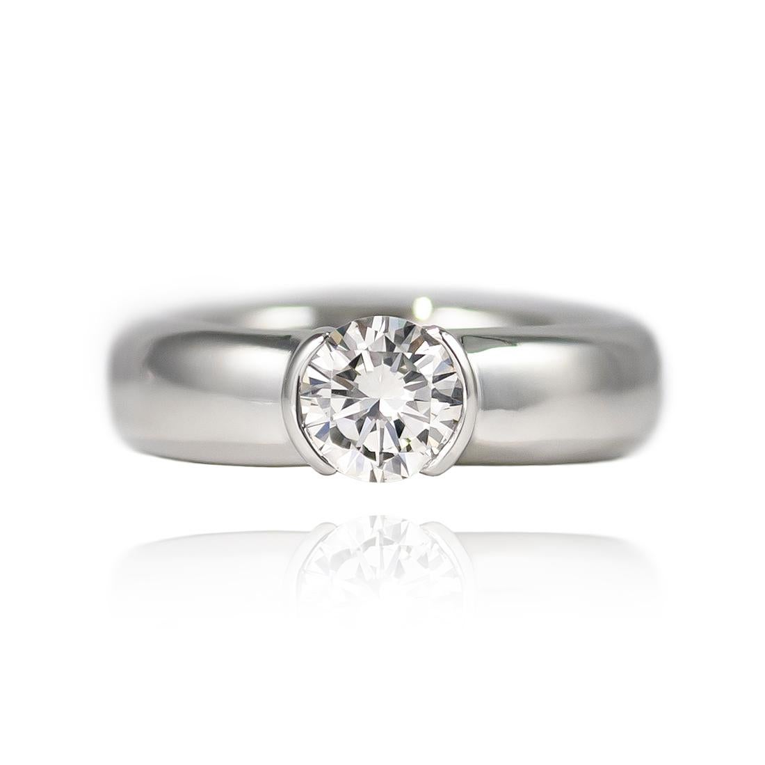 This beautiful, signed Tiffany & Co. Etoile Solitaire ring features a 0.75 ct Brilliant Round diamond of H color and VS1 clarity. The perfect choice for a modern bride, this ring is a contemporary alternative to the traditional solitaire engagement
