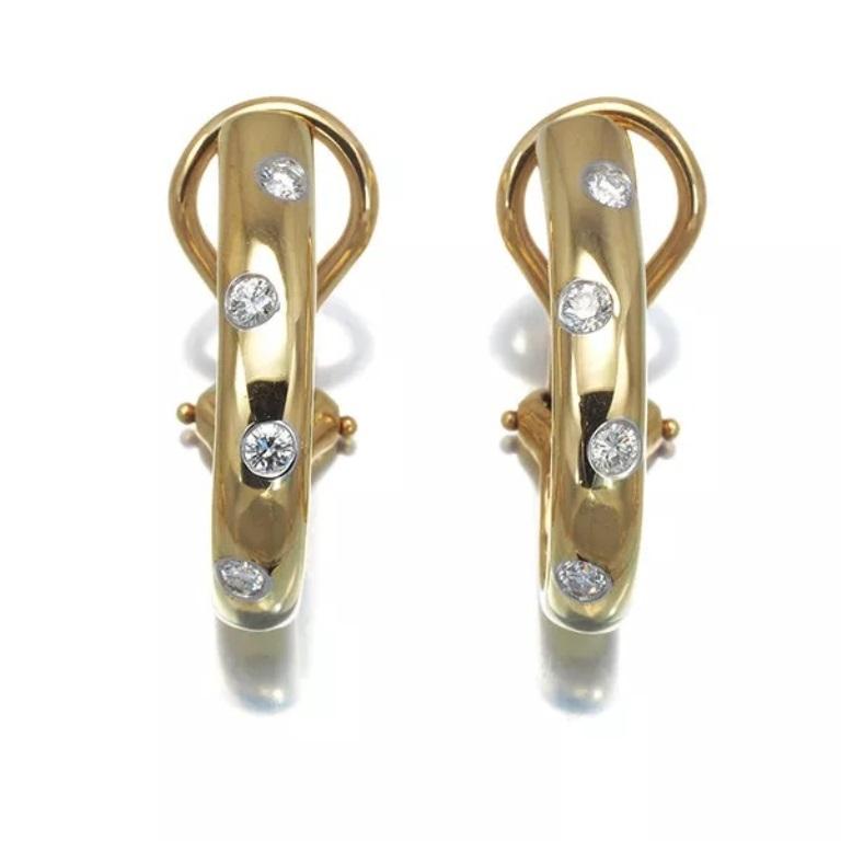 TIFFANY & Co. Etoile 18K Gold .18ct Diamond Clip-On Hoop Earrings

Metal: 18K Yellow Gold
Weight: 7.70 grams 
Measurements: 20mm (0.79