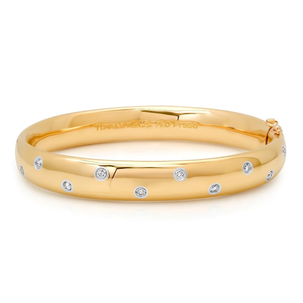 TIFFANY & Co. Etoile Bracelet jonc large 9 mm de large en or 18 carats

Métal : Or jaune 18K
Poids : 43,30 grammes
Diamètre intérieur : Forme ovale, 57mm(2.24