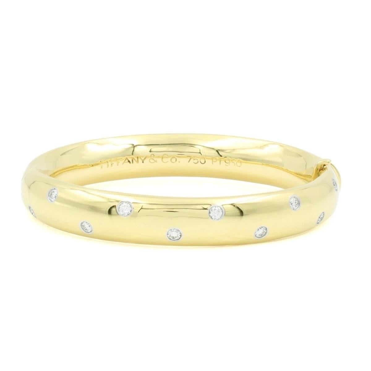 TIFFANY & Co. Etoile 18K Gold 9mm Wide Diamond Bangle Bracelet

Metal: 18K Yellow Gold
Weight: 39.30 grams
Inside Circumference: 5.5