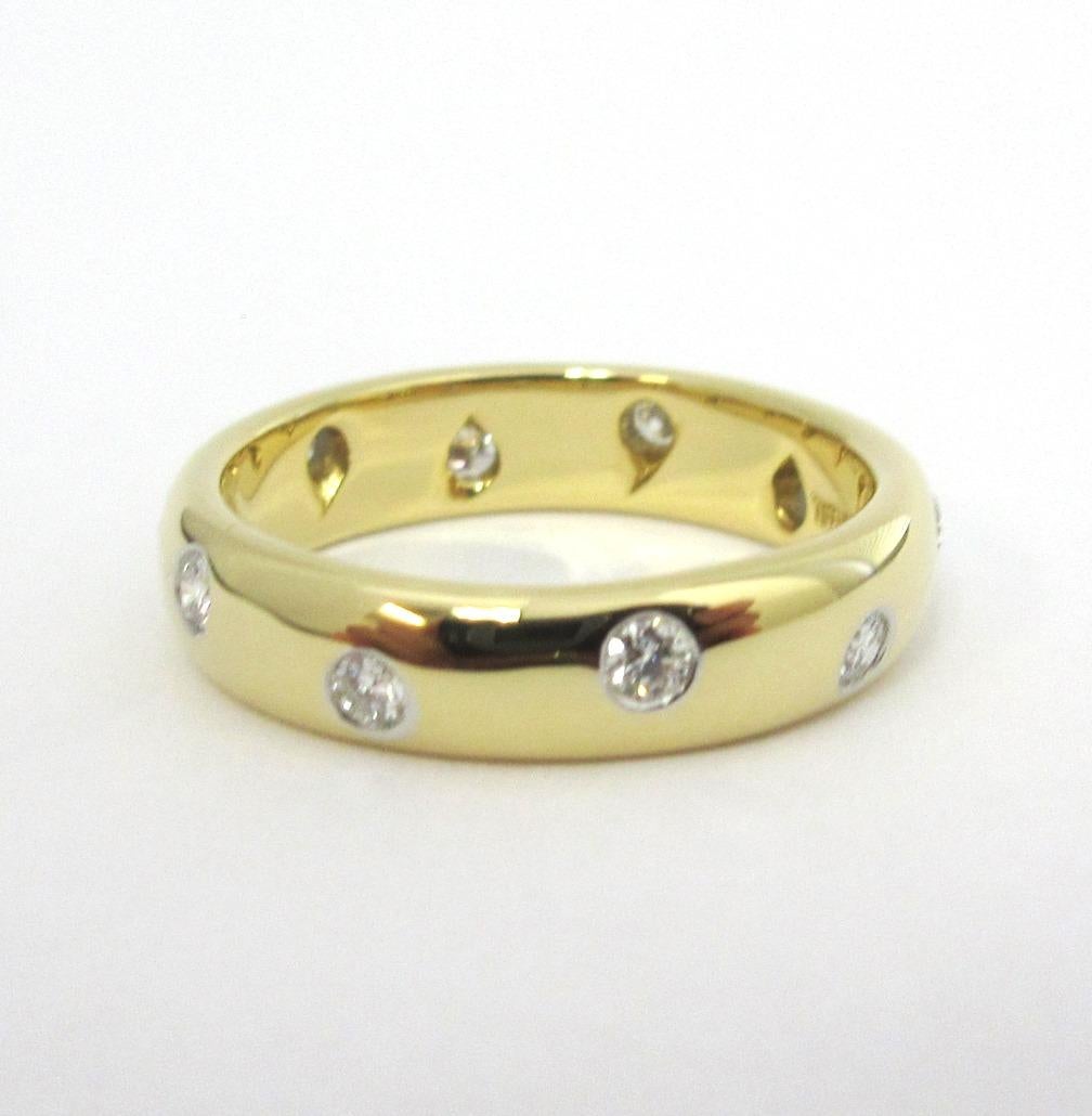 TIFFANY & Co. Etoile 18K Gold Diamond 4mm Band Ring 5

Metal: 18K Gold
Size: 5 
Band Width: 4mm
Diamond: 10 round brilliant diamonds, carat total weight .22
Hallmark: TIFFANY&CO. 750 PT950 
Condition: Excellent condition, like new, comes with the