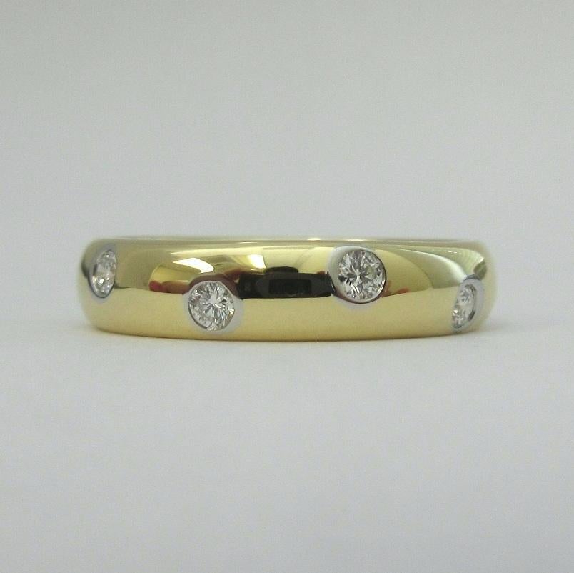 TIFFANY & Co. Etoile 18K Gold Diamond 4mm Band Ring 5

Metal: 18K Gold
Size: 5 
Band Width: 4mm
Diamond: 10 round brilliant diamonds, carat total weight .22
Hallmark: TIFFANY&CO. 750 PT950 
Condition: Excellent condition, like new, comes with the