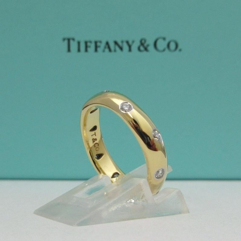 TIFFANY & Co. Etoile 18K Gold Diamond 4mm Band Ring 5.5 

Metal: 18K Gold 
Size: 5.5 
Band Width: 4mm
Diamond: 10 round brilliant diamonds, carat total weight .22
Hallmark: T&Co. 750 PT950 
Condition: Excellent condition, like new, comes with