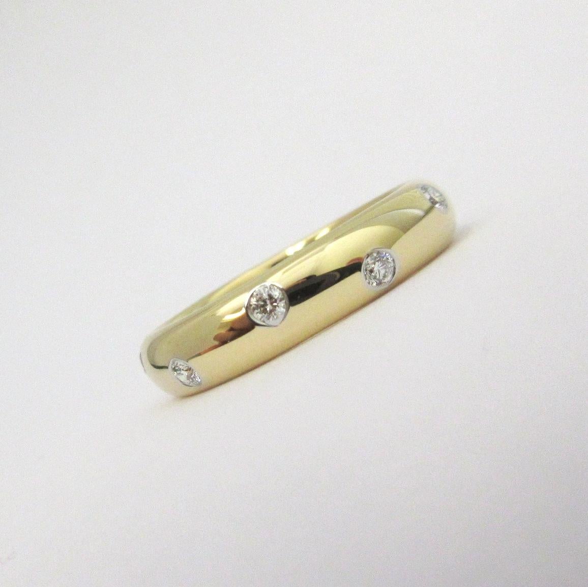TIFFANY & Co. Etoile 18K Gold Diamond 4mm Band Ring 6.5

Metal: 18K Gold
Size: 6.5 
Band Width: 4mm
Diamond: 10 round brilliant diamonds, carat total weight .22
Hallmark: T&CO. 750 PT950 
Condition: Excellent condition, like new, comes with Tiffany