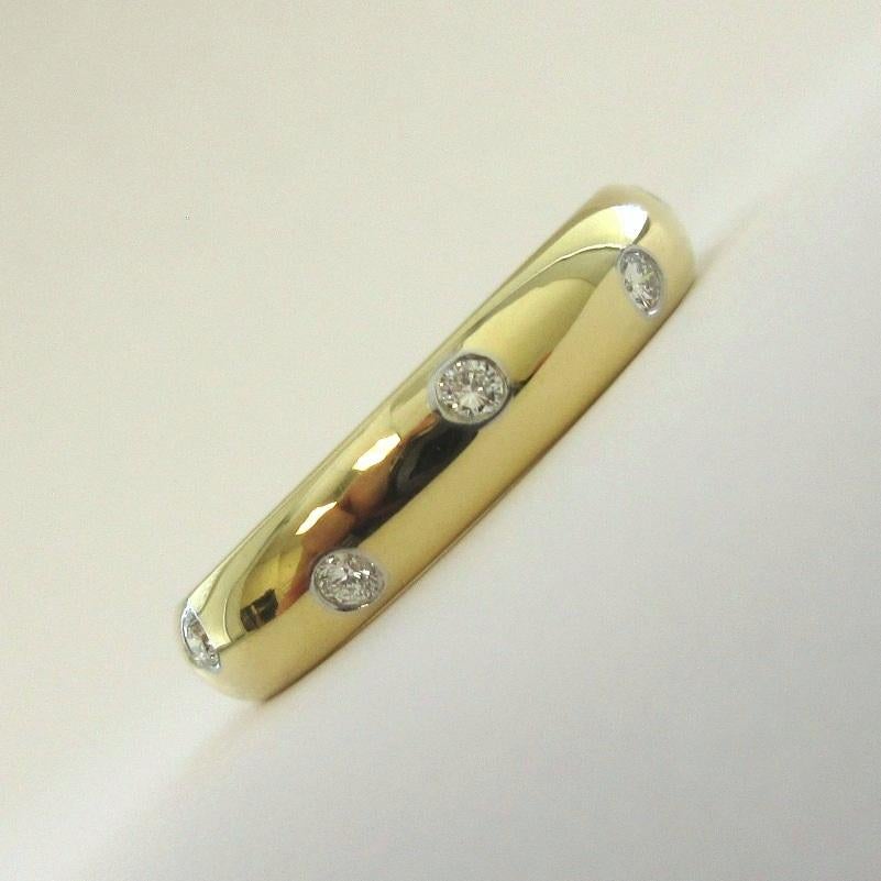 TIFFANY & Co. Etoile 18K Gold Diamond 4mm Band Ring 7

Metal: 18K Gold
Size: 7 
Band Width: 4mm
Diamond: 10 round brilliant diamonds, carat total weight .22
Hallmark: TIFFANY&CO. 750 PT950 
Condition: Excellent condition, like new, comes with