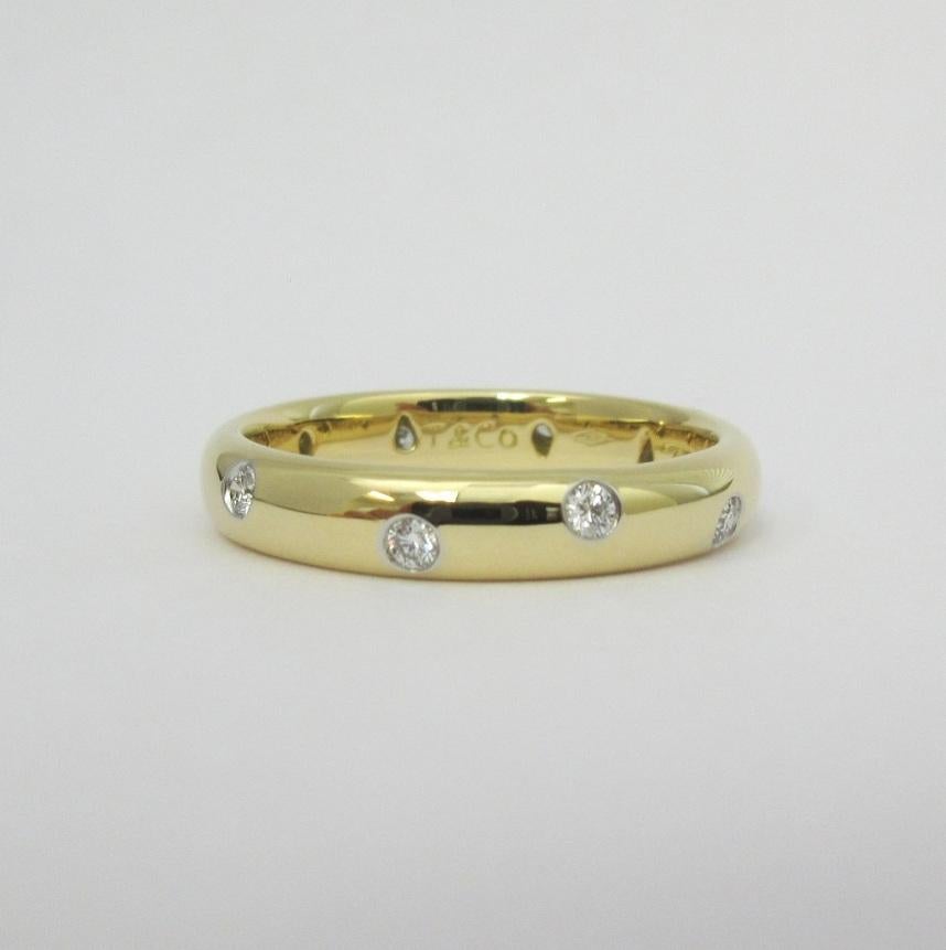 TIFFANY & Co. Etoile 18K Gold Diamond 4mm Band Ring 9

Metal: 18K Gold
Size: 9 
Band Width: 4mm
Diamond: 10 round brilliant diamonds, carat total weight .22
Hallmark: T&CO. 750 PT950 
Condition: Excellent condition, like new, comes with Tiffany