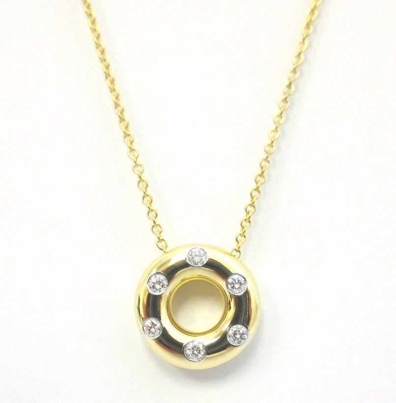 TIFFANY & Co. Etoile 18K Gold Diamant-Halskette mit Kreis-Anhänger

Metall: 18K Gold
Gewicht: 5,30 Gramm
Kette: 16