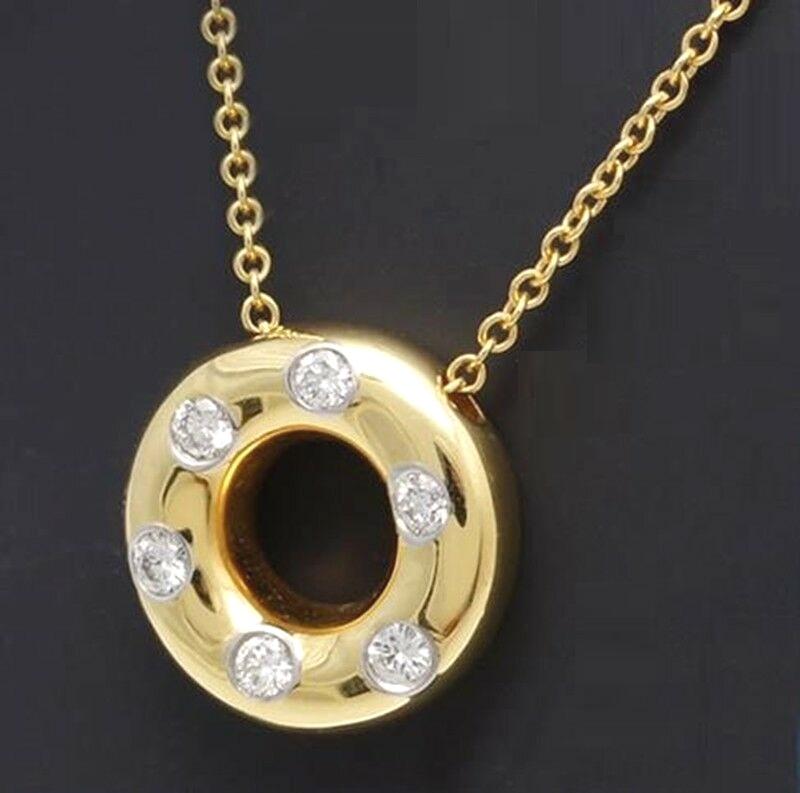 TIFFANY & Co. Etoile 18K Gold Diamond Circle Pendant Necklace

Metal: 18K Gold
Weight: 5.0 grams
Chain: 16