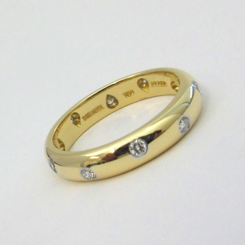 TIFFANY & Co. Etoile 18K Gold Platinum Diamond Band Ring 7

Metal: 18K Gold and platinum 
Size: 7 
Band Width: 4mm
Diamond: 10 round brilliant diamonds, carat total weight .22
Hallmark: TIFFANY&CO. 750 PT950 
Condition: Excellent condition, like