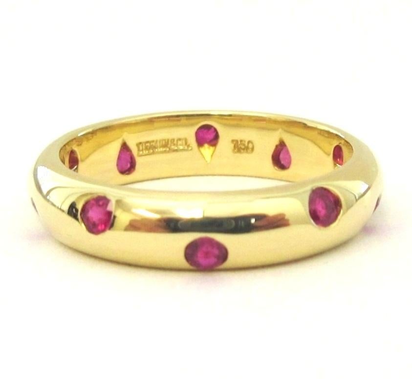 TIFFANY & Co. Etoile 18K Gold Ruby Band Ring 5

Metal: 18K Yellow Gold 
Size: 5
Band Width: 4mm
Weight: 4.30 grams
Ruby: 10 round rubies, carat total weight .25 
Hallmark: TIFFANY&CO. 750 
Condition: Like new

Limited edition, no longer available