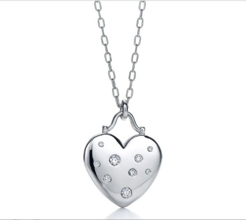 TIFFANY & Co. Etoile 18K White Gold 9 Diamond Heart Pendant Necklace

Metal: 18K white gold
Weight: 14.40 grams
Chain: 16