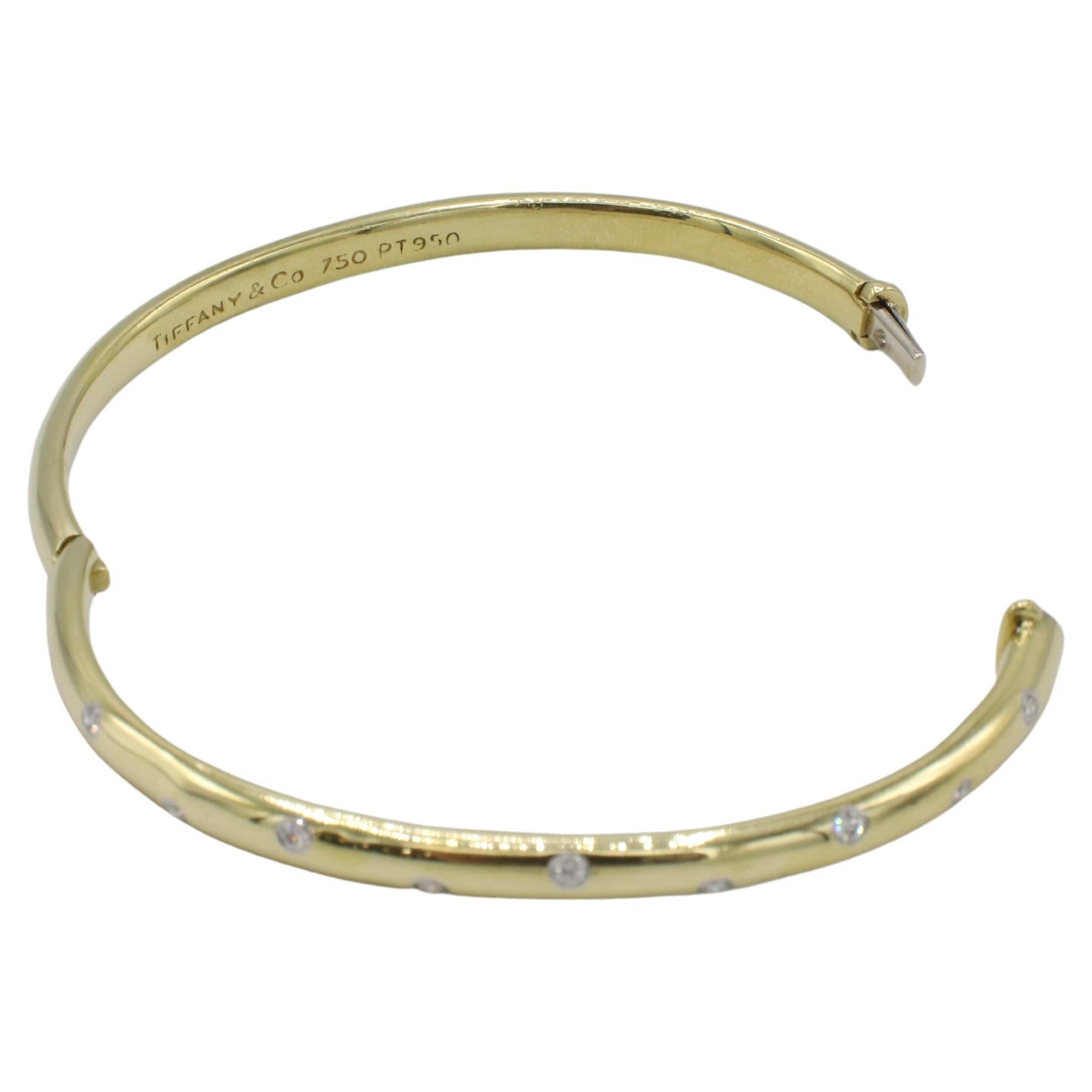 Tiffany & Co. Armreif aus 18 Karat Gelbgold und Platin mit natürlichen Diamanten von Etoile (Rundschliff) im Angebot
