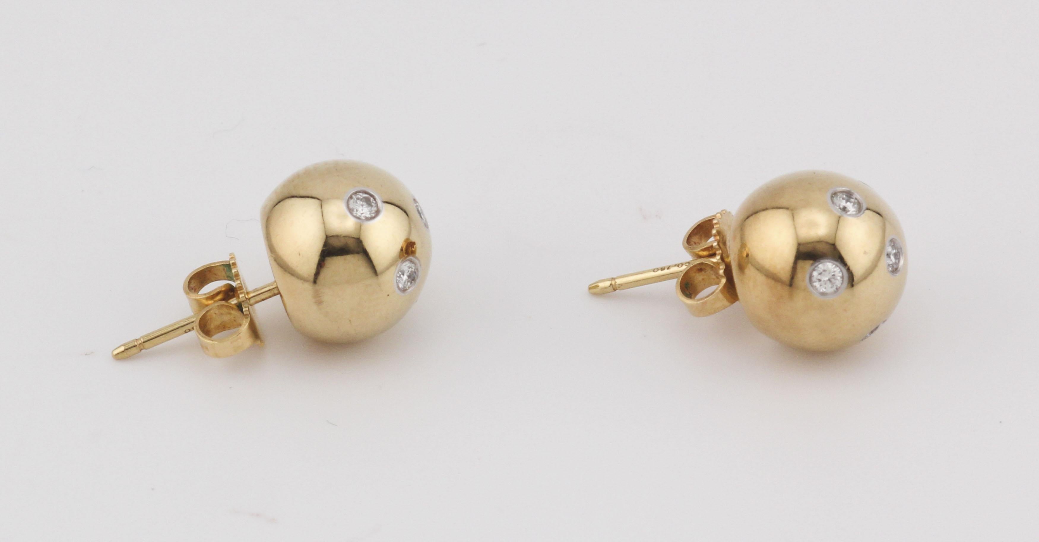 The Tiffany & Co. Etoile Diamond Stud Earrings are a timeless celebration of understated elegance and sophistication. These luxurious earrings feature perfectly round 18k yellow gold balls, enhanced with a sprinkling of brilliant-cut diamonds set in