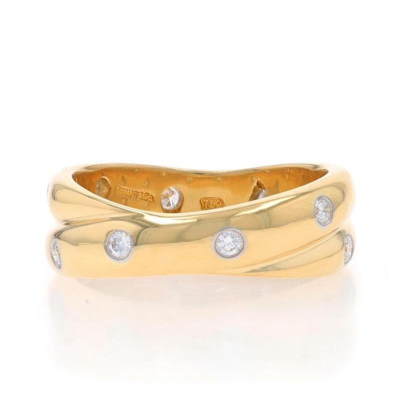 Size: 7 1/2

Brand: Tiffany & Co.
Collection: Etoile
Design:  Crossover

Metal Content: 18k Yellow Gold & Platinum

Stone Information

Natural Diamonds
Carat(s): .30ctw
Cut: Round Brilliant
Color: F - G
Clarity: VS1 - VS2

Total Carats: