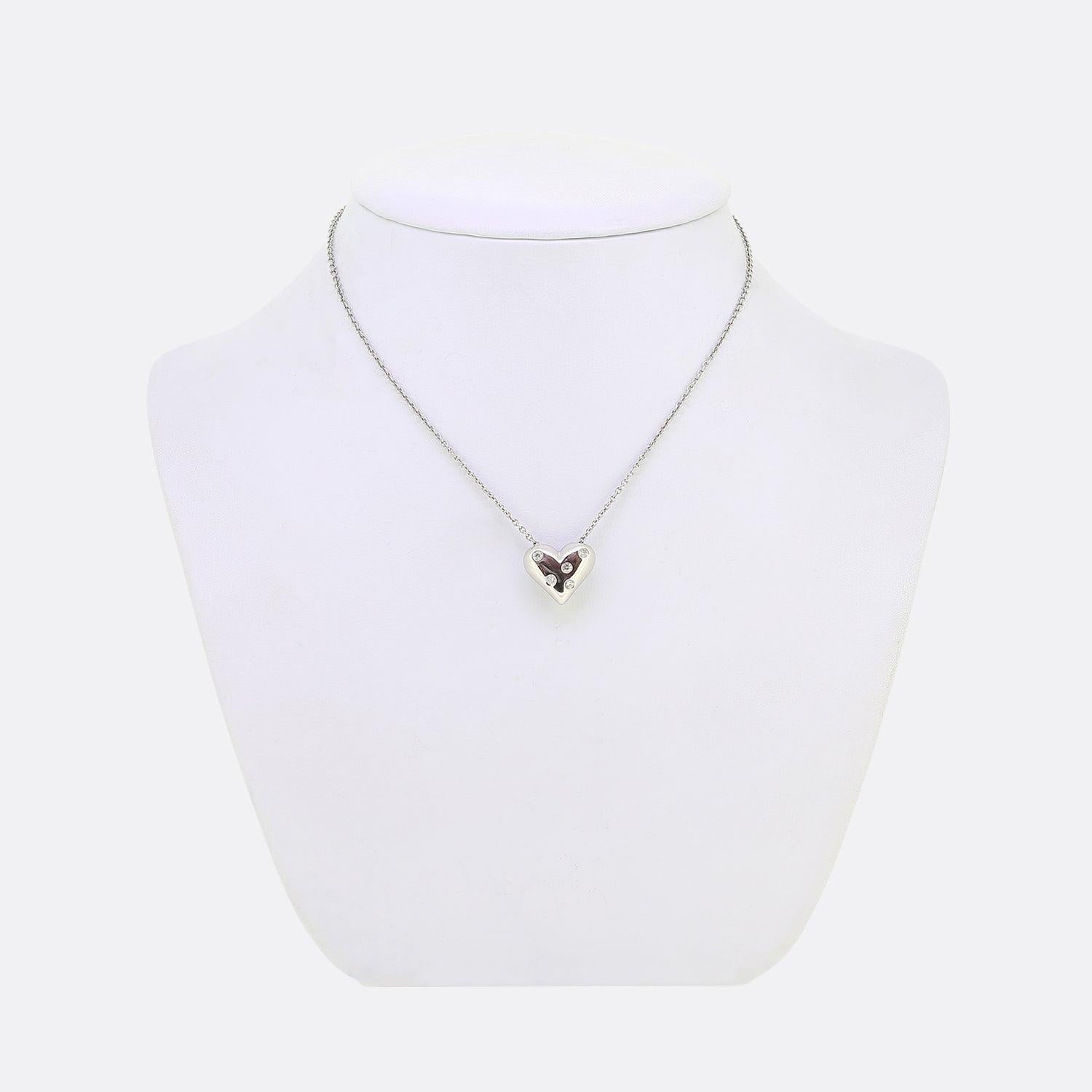 Here we have a lovely necklace from the world renowned luxury jewellery designer Tiffany & Co. This pendant is crafted from platinum into the shape of a love heart and adorned with five ru-over set round brilliant cuts. This pendant hangs from a
