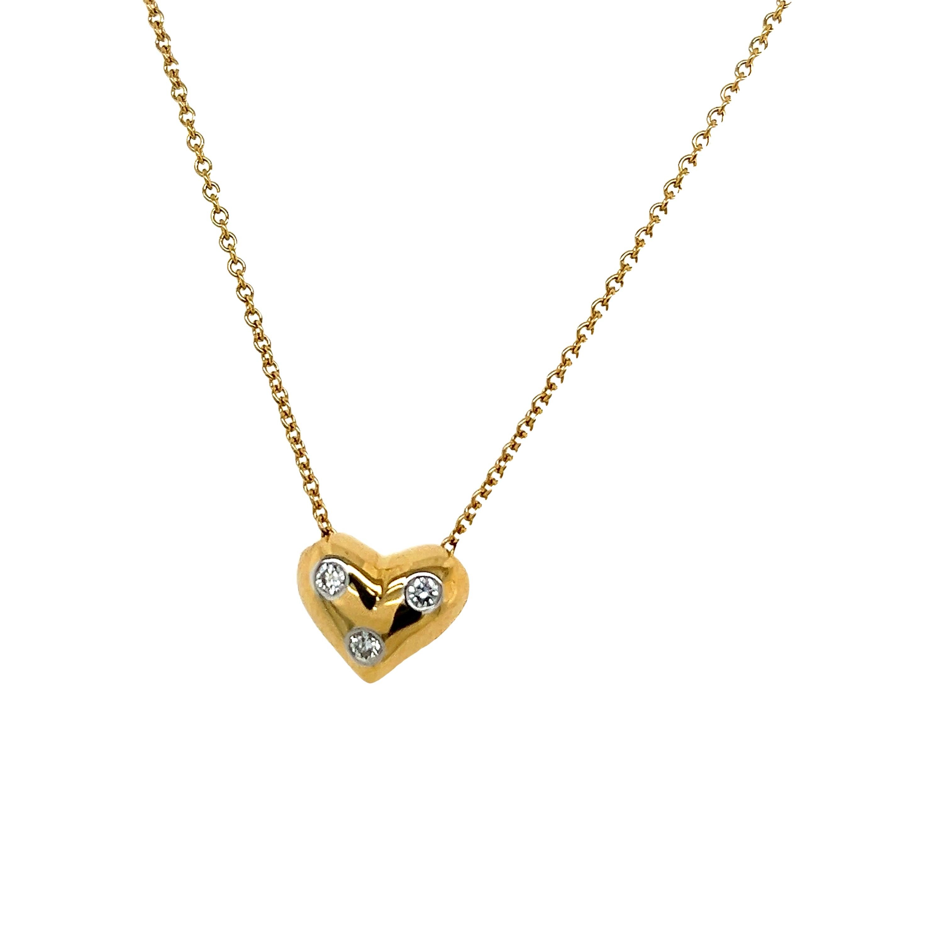 Introducing the breathtaking Tiffany & Co. Etoile Diamond Heart Pendant, a timeless symbol of love and elegance. Crafted with meticulous attention to detail, this exquisite pendant features a delicate heart-shaped design adorned with dazzling round