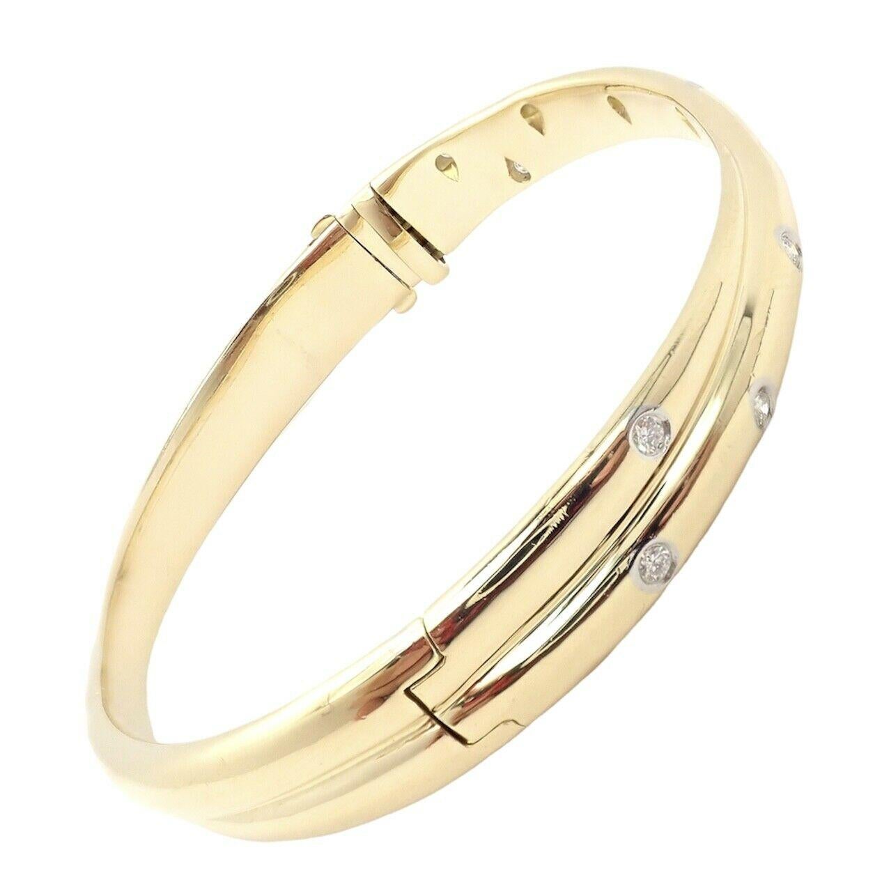 Platinum And 18k Yellow Gold Diamond Etiole Crossover Bangle Bracelet by Tiffany & Co.  
With 10 round brilliant cut diamonds VS1 clarity, E color total weight 
approx. .50ctw

Details:  
Weight: 40.8 grams
Length: 6 3/4