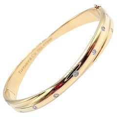Crossover-Armreif von Tiffany & Co Etoile, Diamant Gelbgold Platin