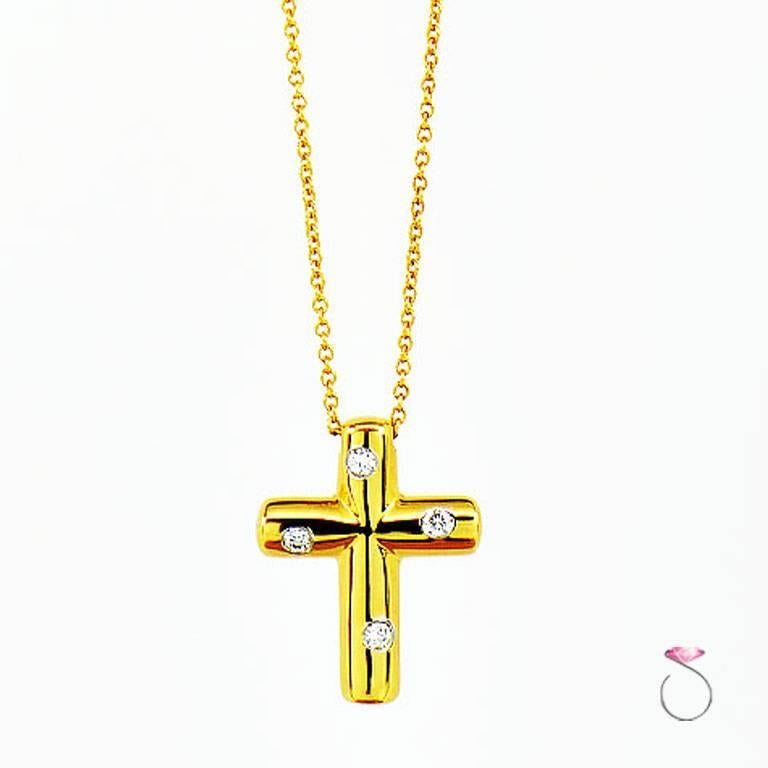 Authentic Tiffany & co. Etoile diamond Cross pendant with 18K yellow gold chain. Gorgeous cross by Tiffany from their Etoile collection. The cross features 4 round brilliant diamonds set in platinum on the 18k yellow gold cross. The cross hangs on a