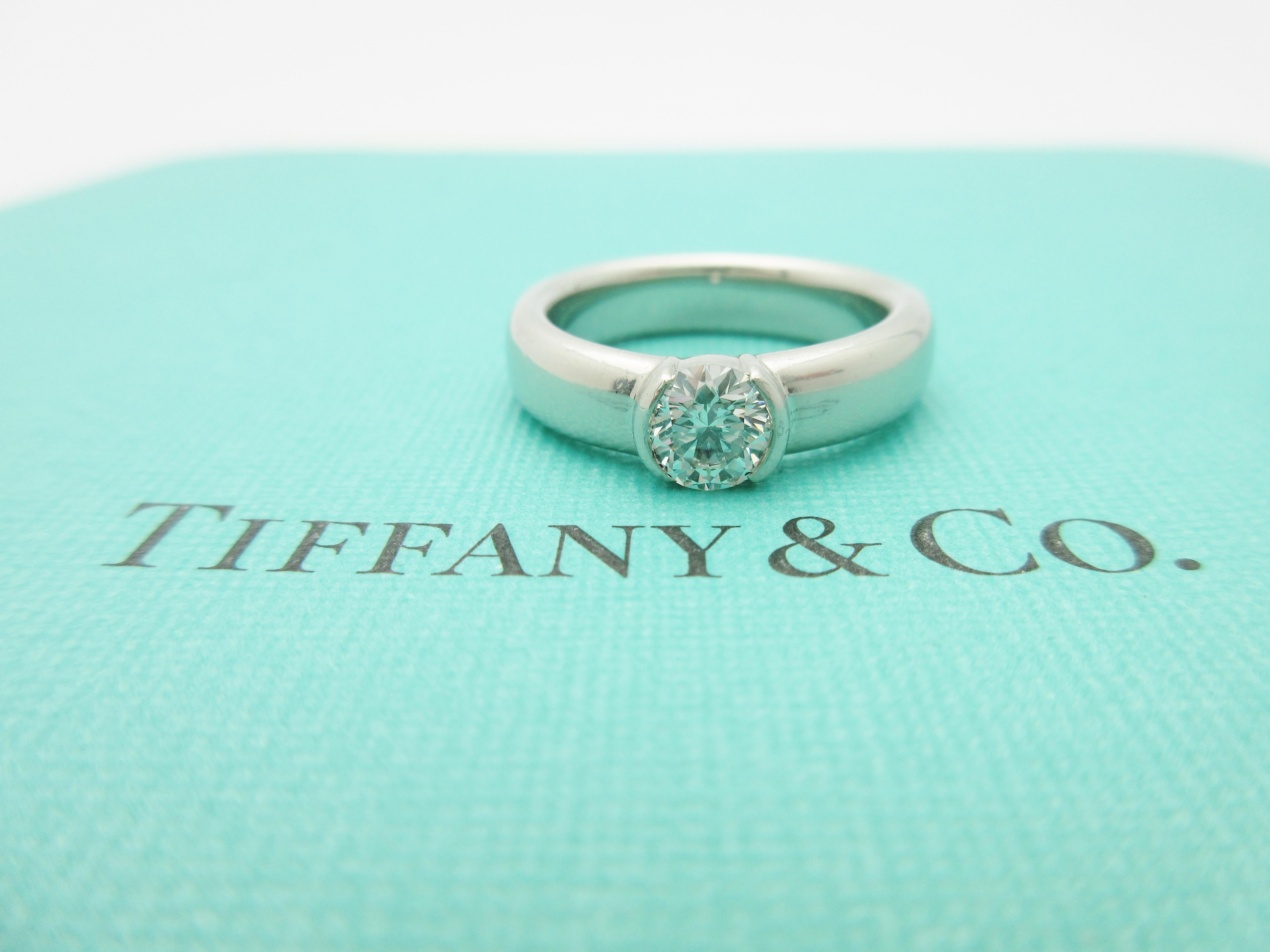 This gorgeous piece from the famed Tiffany & Co. jewelry house is a fiery diamond dazzler.

The focal point of this engagement ring is a Tiffany-graded natural diamond. Weighing .70ct, it has been graded I in color and VS2 clarity by Tiffany's