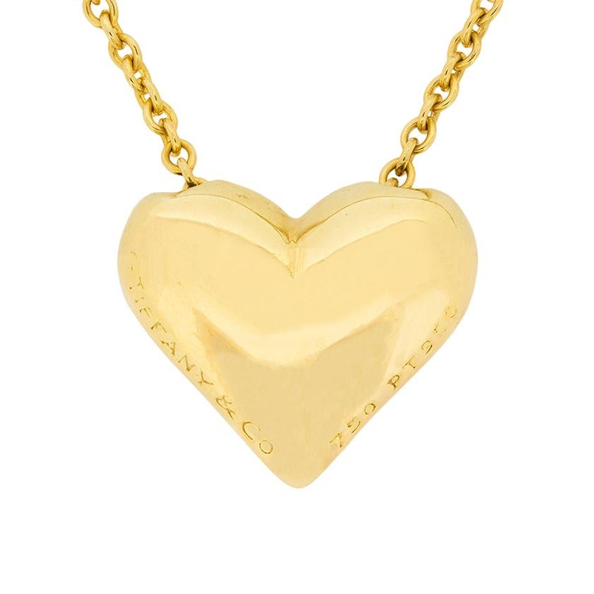 From the Etoile collection at Tiffany & Co comes this heart shaped pendant. It features five rub over set diamonds which combine to a weight of 0.11 carat. All match in quality, F in colour and VS1 in clarity. All the round brilliants are rub over