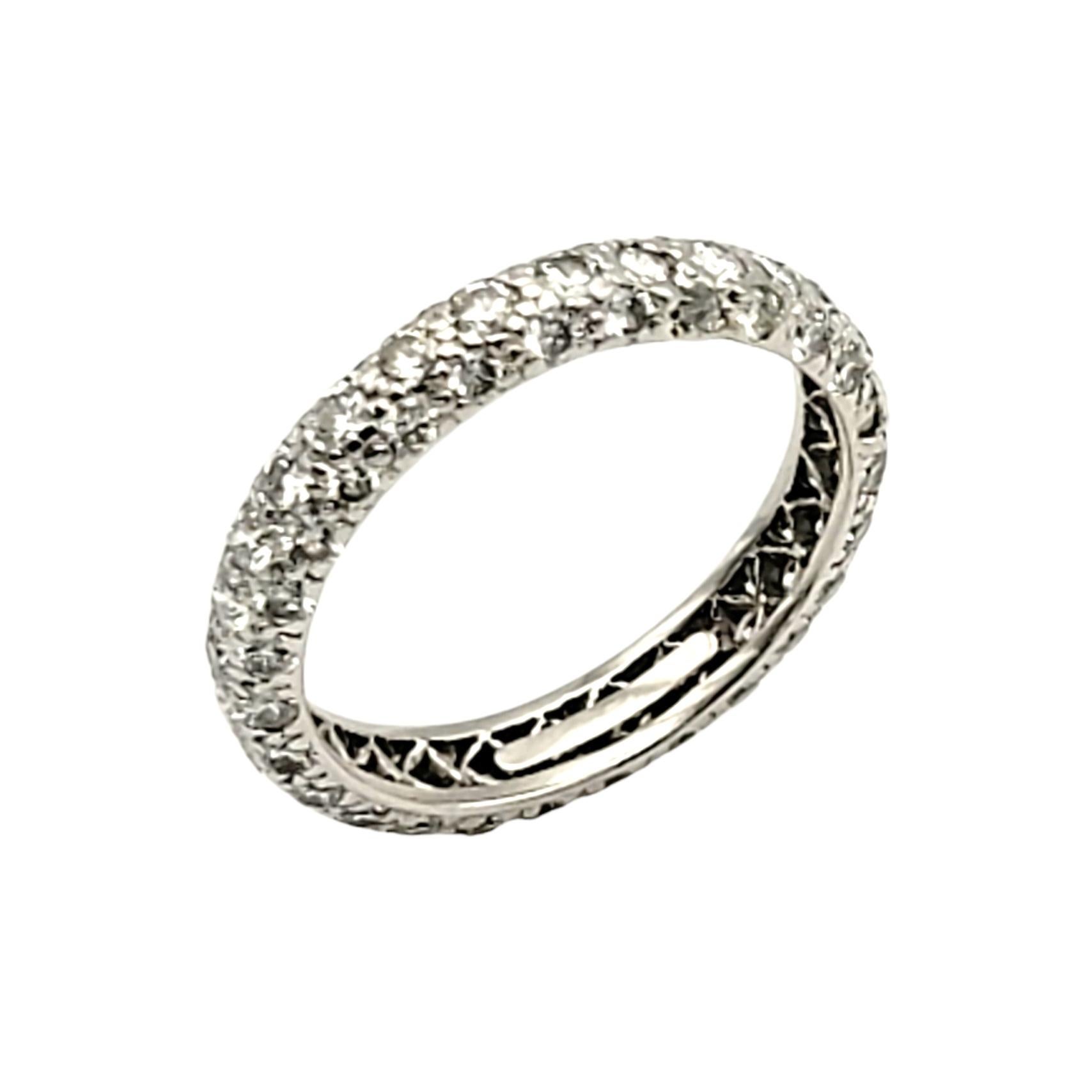 Ring size: 6

Modern and chic diamond eternity band ring from the Tiffany & Co. 'Etoile' collection. This gorgeous ring features 1.76 carats of bright, icy white pave diamonds set in multiple rows in a highly polished platinum setting. The platinum