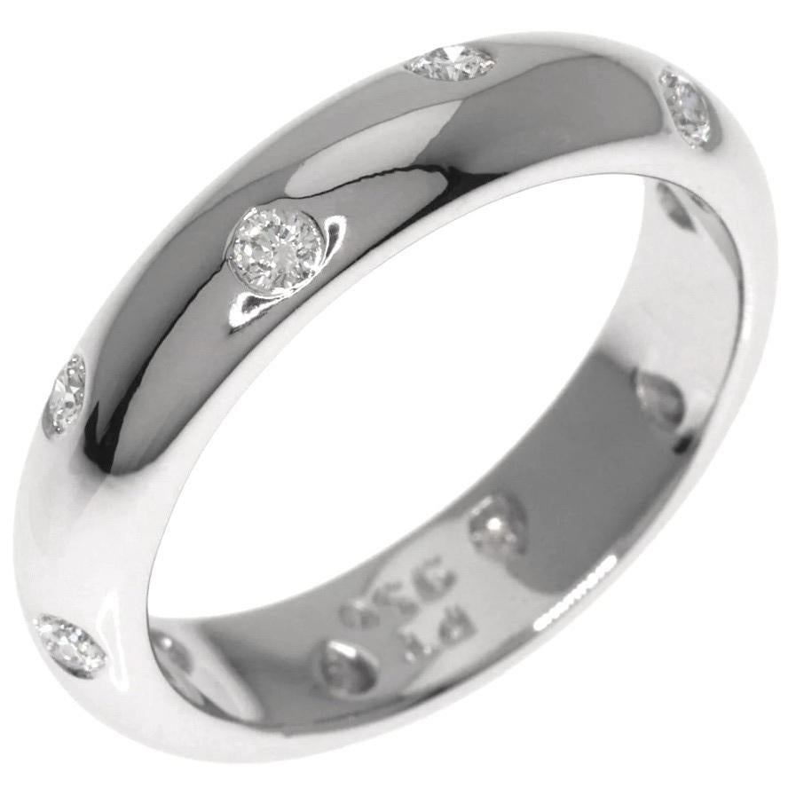 TIFFANY & Co. Etoile Platinum Diamond 4mm Band Ring 5

 Metal: Platinum
 Size: 5 
 Band Width: 4mm
 Weight: 7.0 grams 
 Diamond: 10 round brilliant diamonds, carat total weight .22
 Hallmark: T&Co. PT950
 Condition: Excellent condition
 Value: